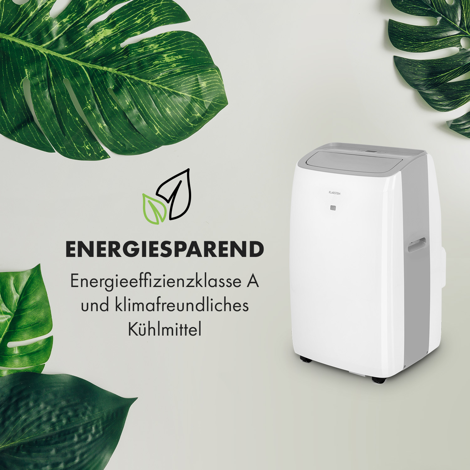 Weißer Klimaanlage mit grünen Blättern auf weißem Hintergrund, mit den Worten "ENERGIESPAREND" und "Energieeffizienzklasse A".