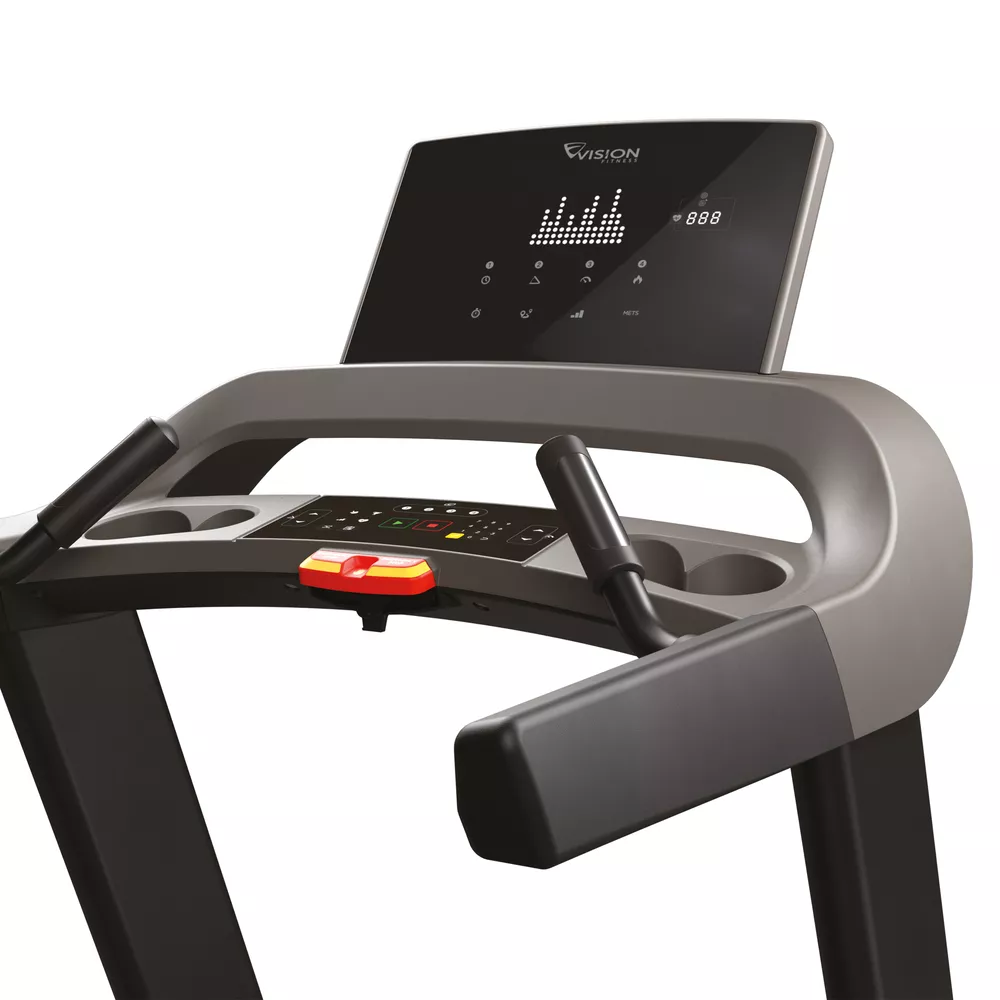 Treadmill control panel, with digital display. Gray handles and console, with a red emergency stop button.