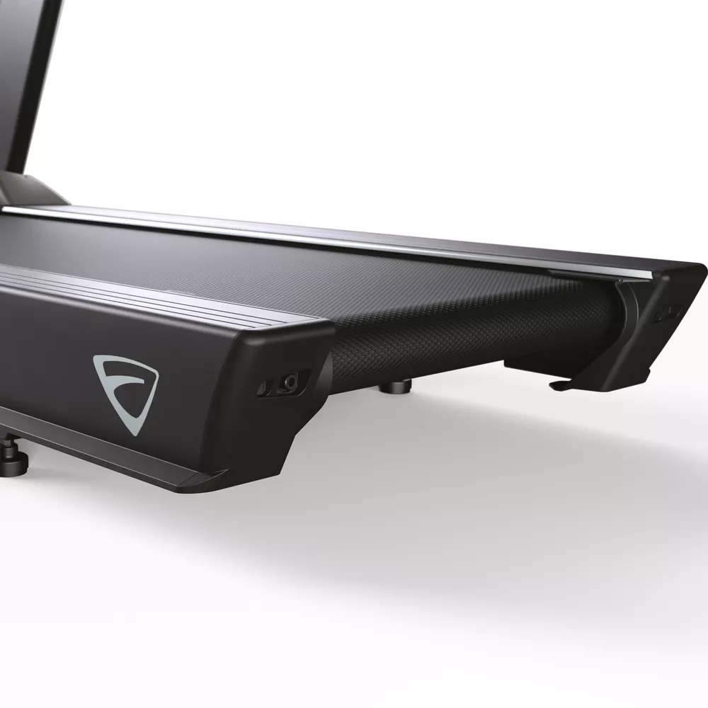 Side view of a treadmill. Black with a silver stripe and a logo. The running surface is visible.