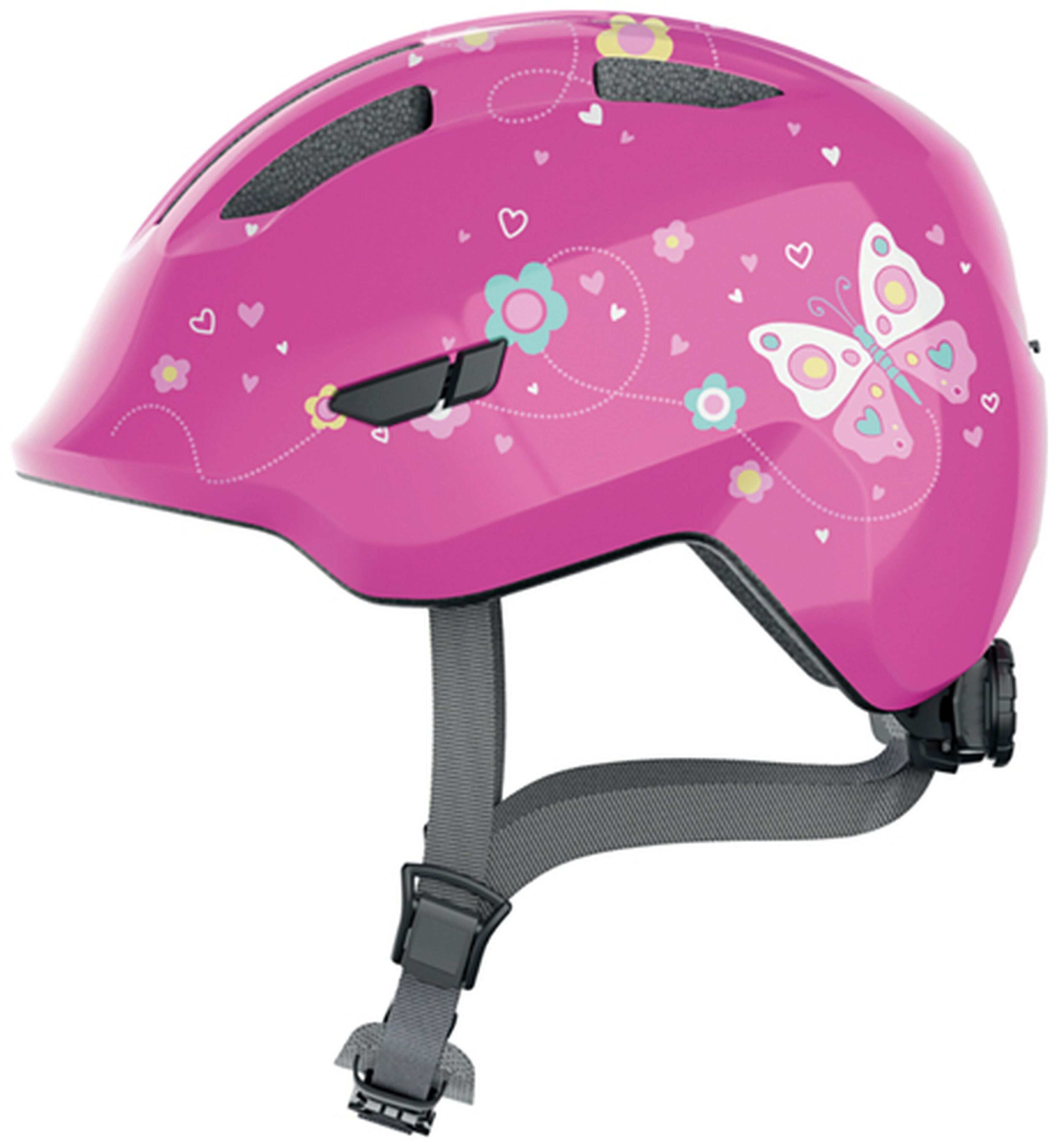 Ein pinker Kinderhelm mit Schmetterlings- und Blumendesigns. Graue Riemen sichern den Helm.