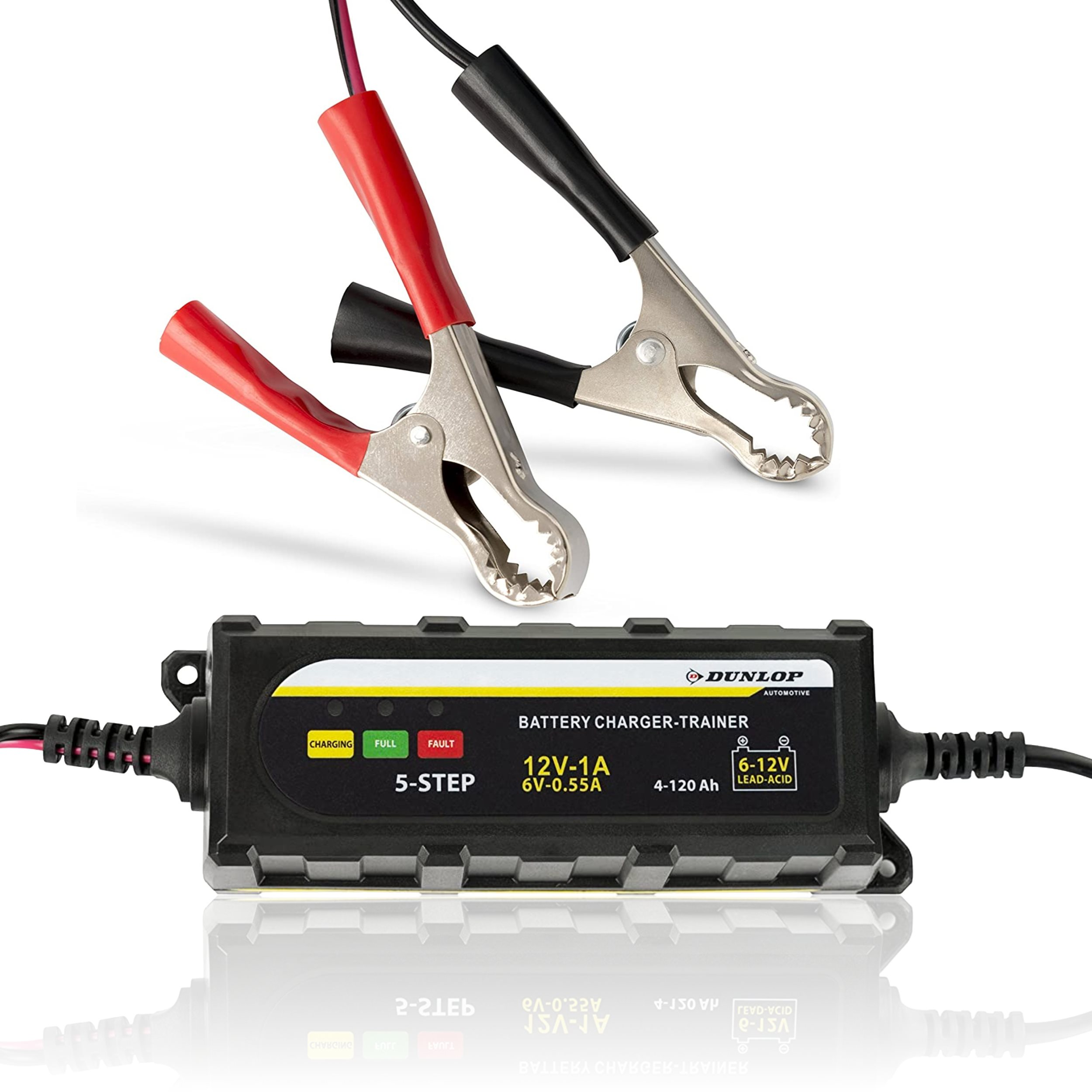 The image displays a black Dunlop battery charger/trainer, featuring red and black clamps on a white background.
