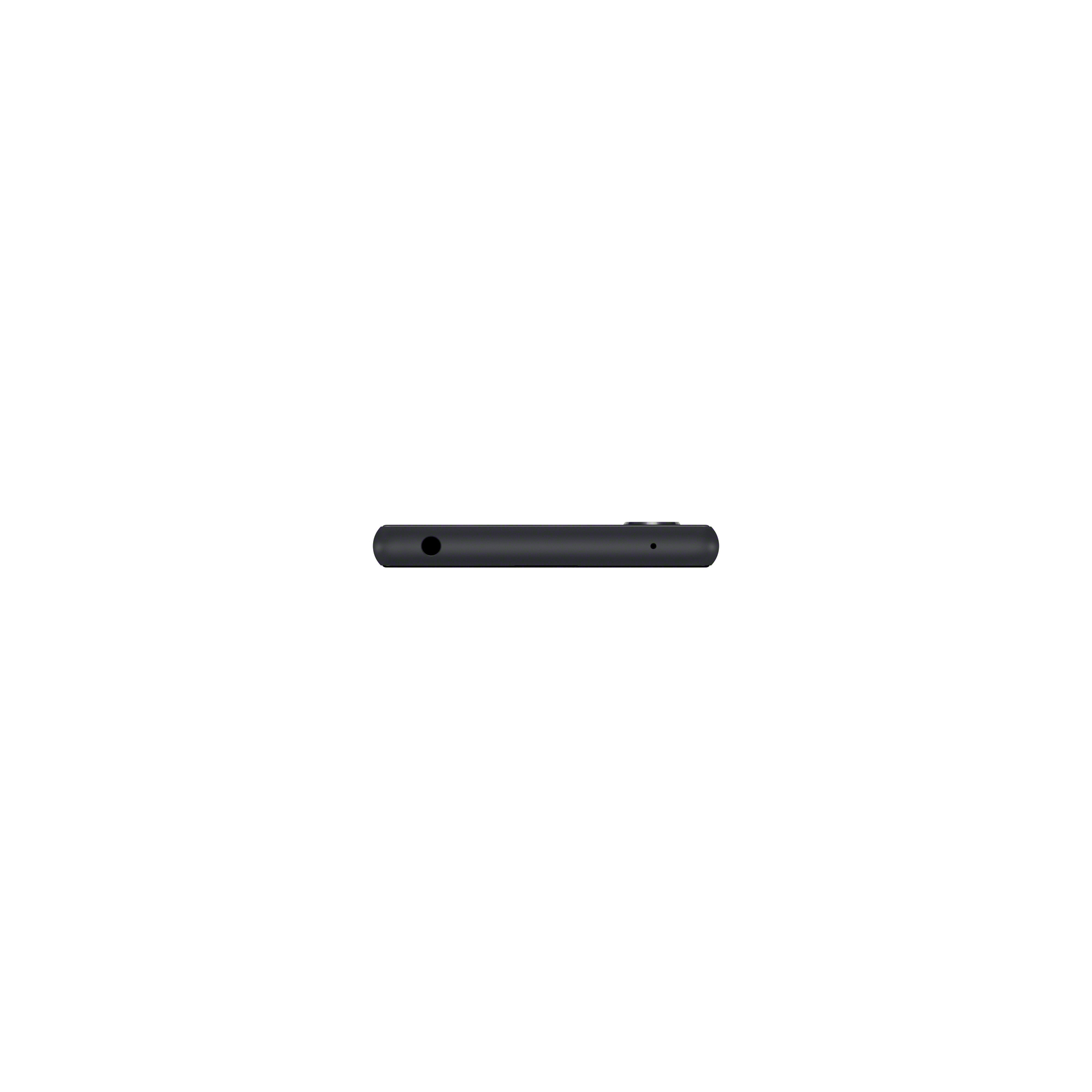 Smartphone nero visto dall'alto. Ha un jack per cuffie e un piccolo pulsante laterale.