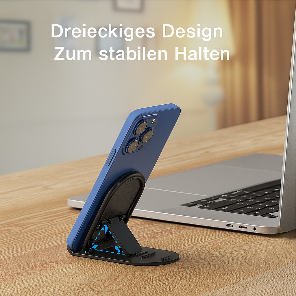 Blaues Telefon in einem Ständer. Ein Laptop ist im Hintergrund.