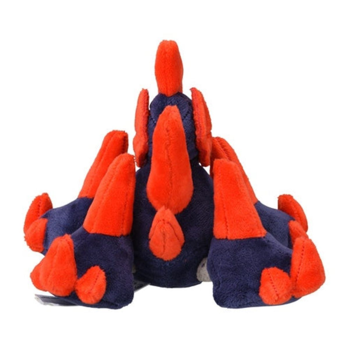 Ein Plüschtier, von hinten gesehen, mit blauem Körper, rotem Schwanz und roten Ohren.