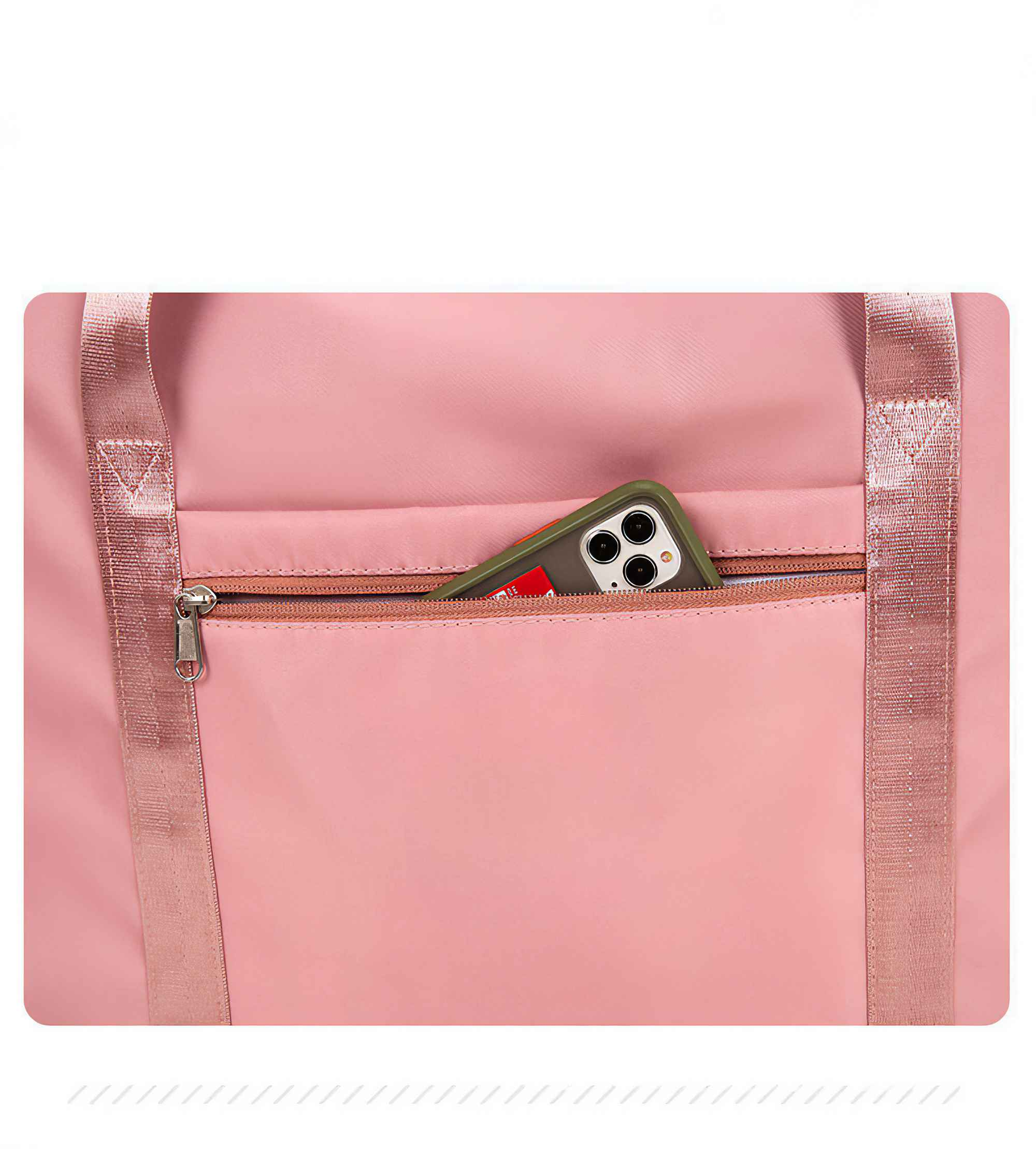 Nahaufnahme einer rosa Reisetasche mit einem Telefon in der Tasche.