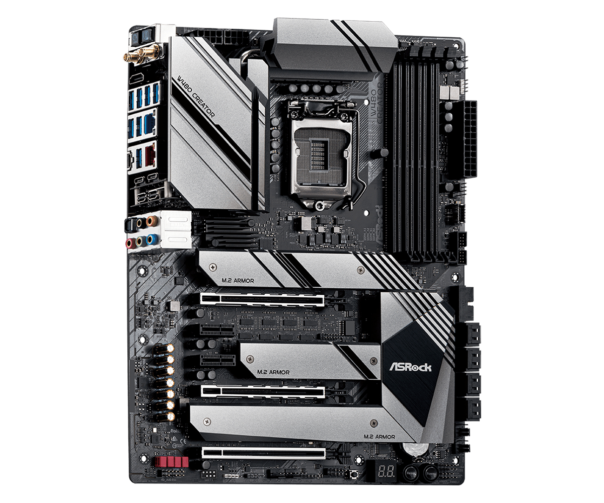 Scheda madre nera con dettagli argentati, in un angolo. Include socket CPU, slot RAM e slot di espansione.