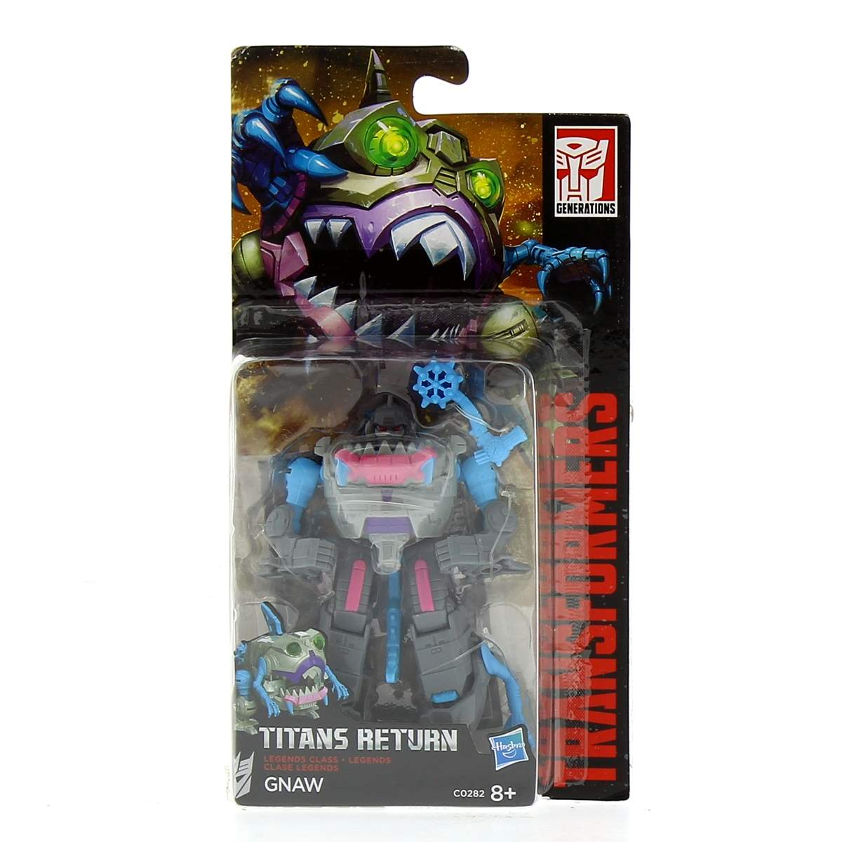 Un juguete Transformers Gnaw en un paquete. El paquete tiene una imagen de monstruo en la parte superior y el juguete debajo.