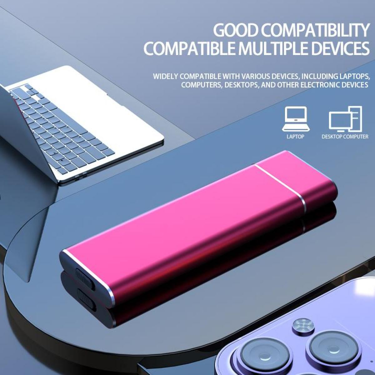 Eine pinkfarbene externe Festplatte auf reflektierender Oberfläche, mit Laptop und Telefon.