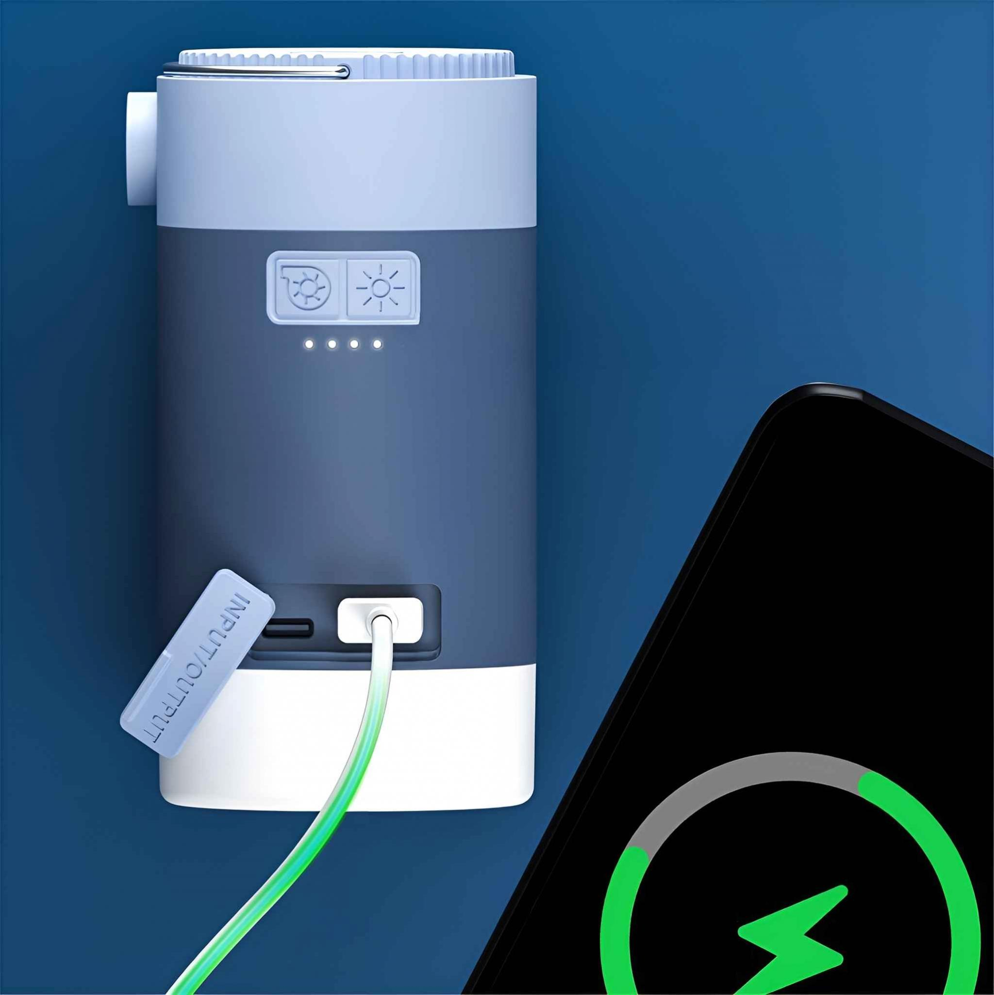 Blaues tragbares Ladegerät mit Telefonladung, grünes Kabel auf blauem Hintergrund.