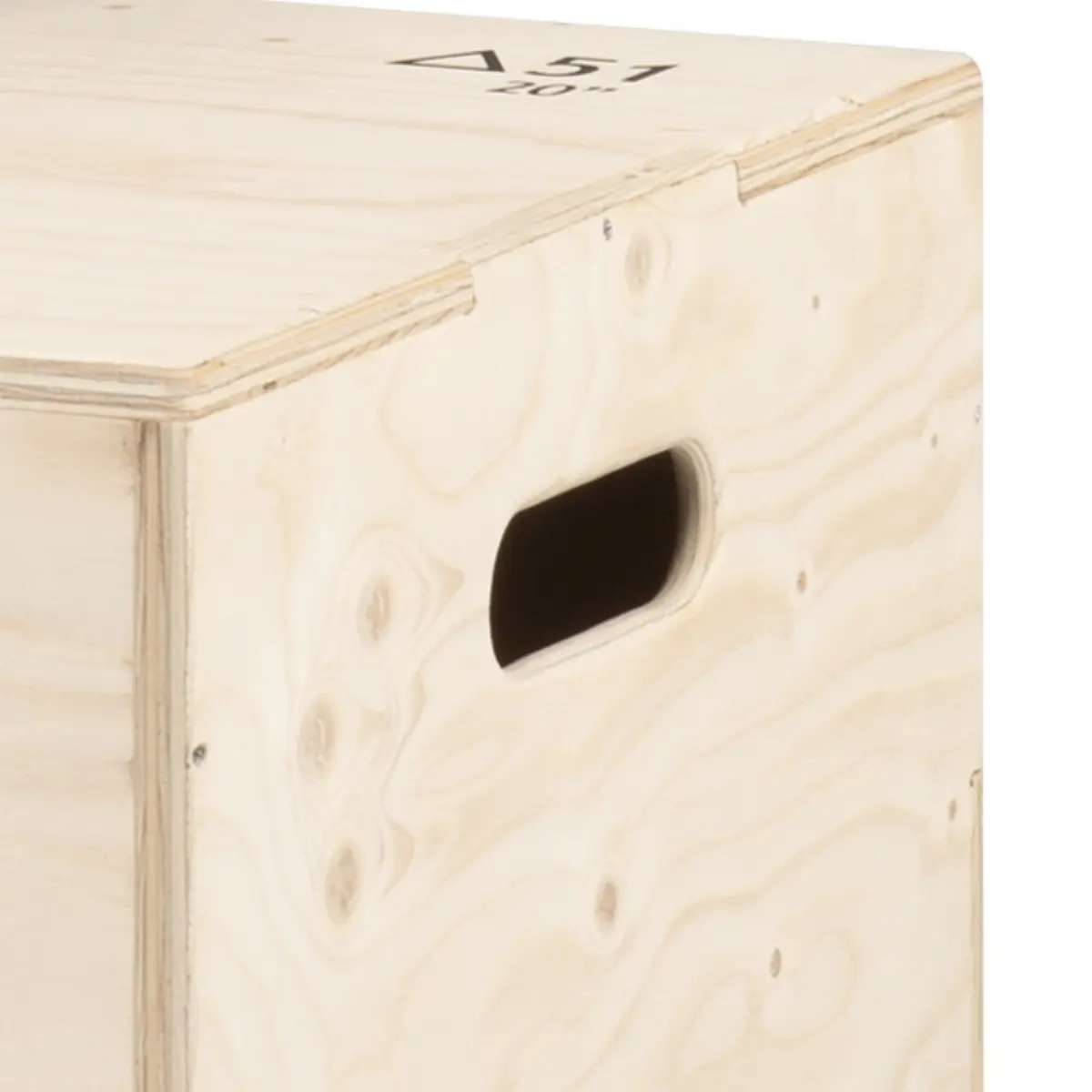 Close up of a wooden plyometric box with a handle cutout.