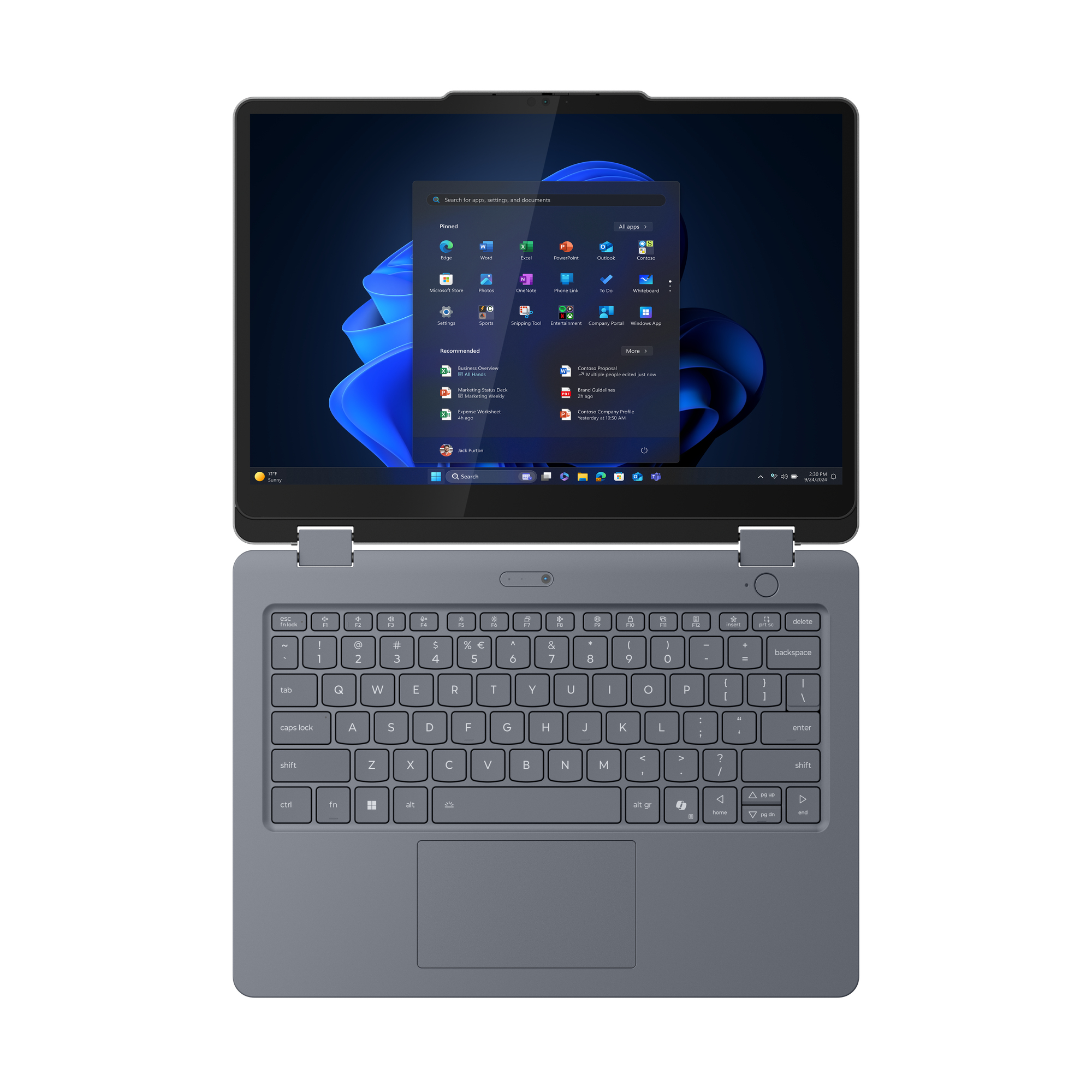 Grauer Laptop geöffnet, zeigt Tastatur und Bildschirm mit Windows-Oberfläche. Der Bildschirm zeigt App-Symbole und Suchleiste.