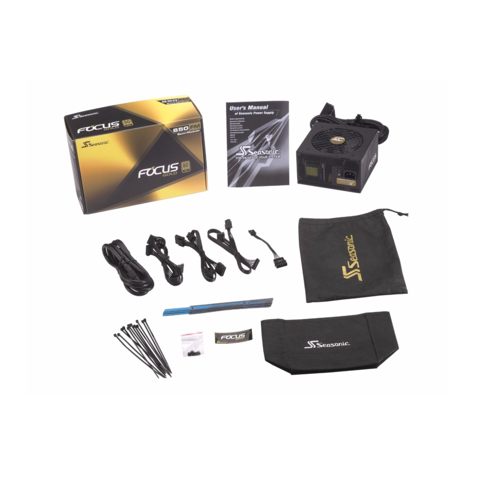 Zestaw zasilacza komputerowego z pudełkiem, instrukcją, kablami, opaskami zaciskowymi i torbą, wszystko na białej powierzchni.