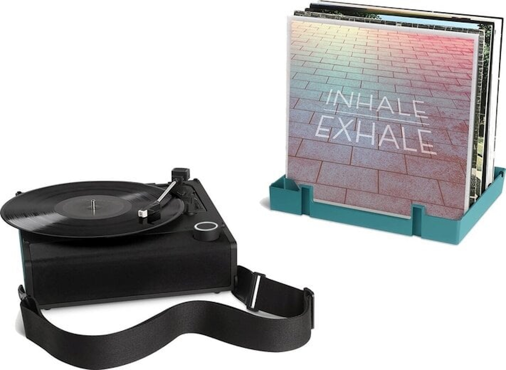 Un giradischi nero con cinturino e un supporto turchese con dischi con scritto 'Inhale Exhale'.
