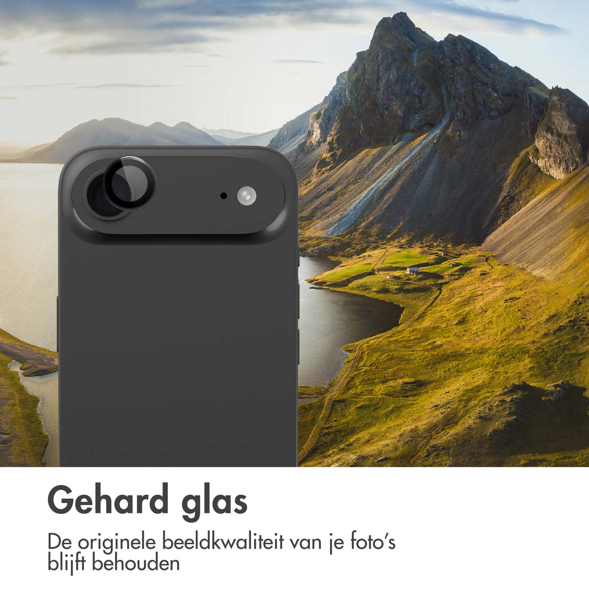 Zwarte telefoon met camera, bergen en meer op de achtergrond.