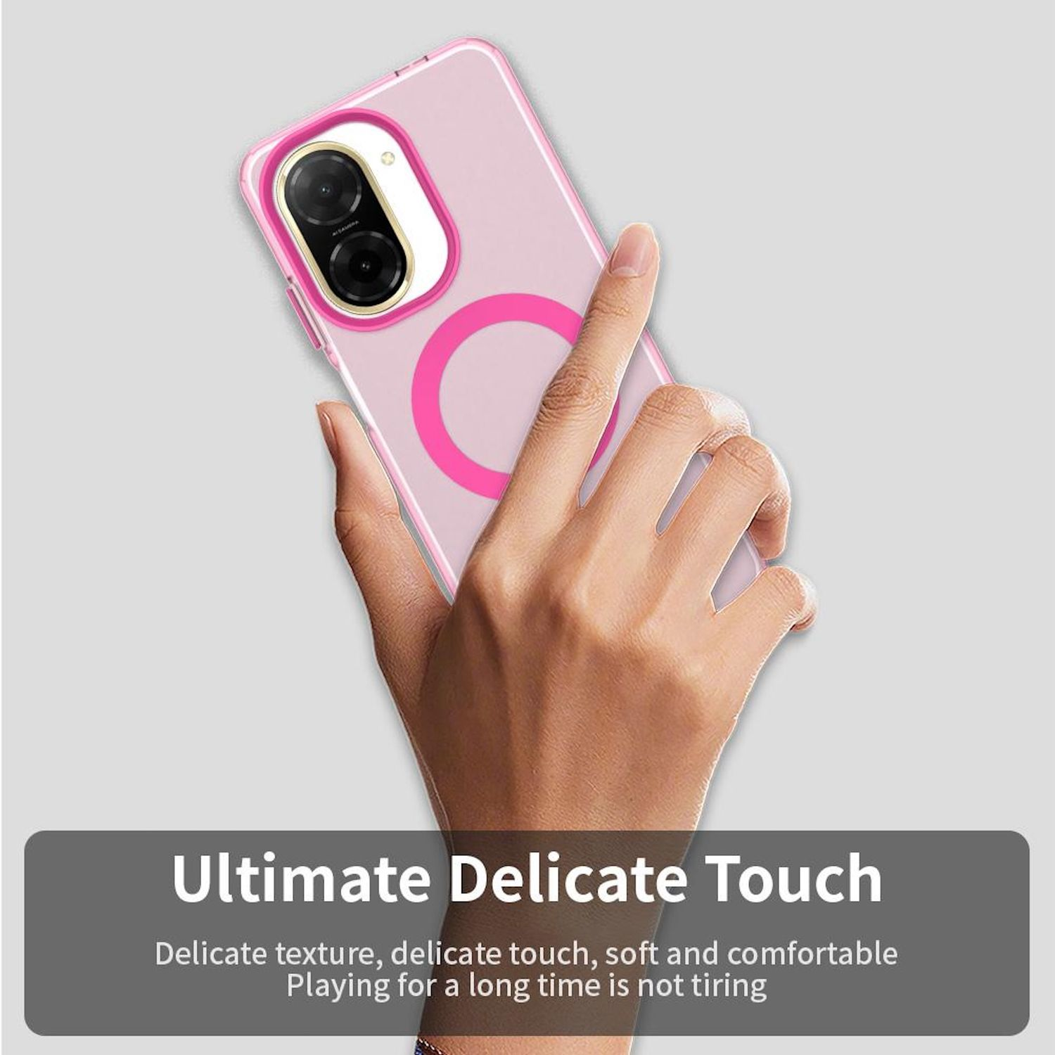 Hand hält ein rosa Telefon mit magnetischer Hülle, ruht auf einer grauen Oberfläche.