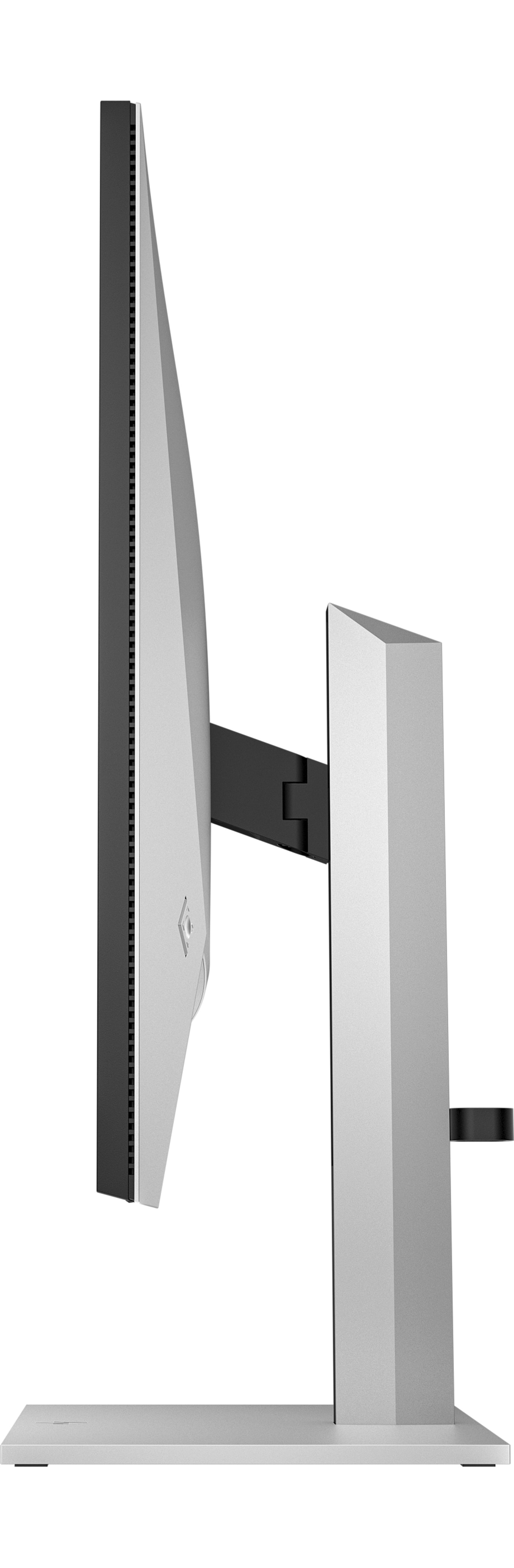 Widok z boku srebrnego monitora komputerowego z czarną ramką i podstawką. Monitor stoi na białej powierzchni.