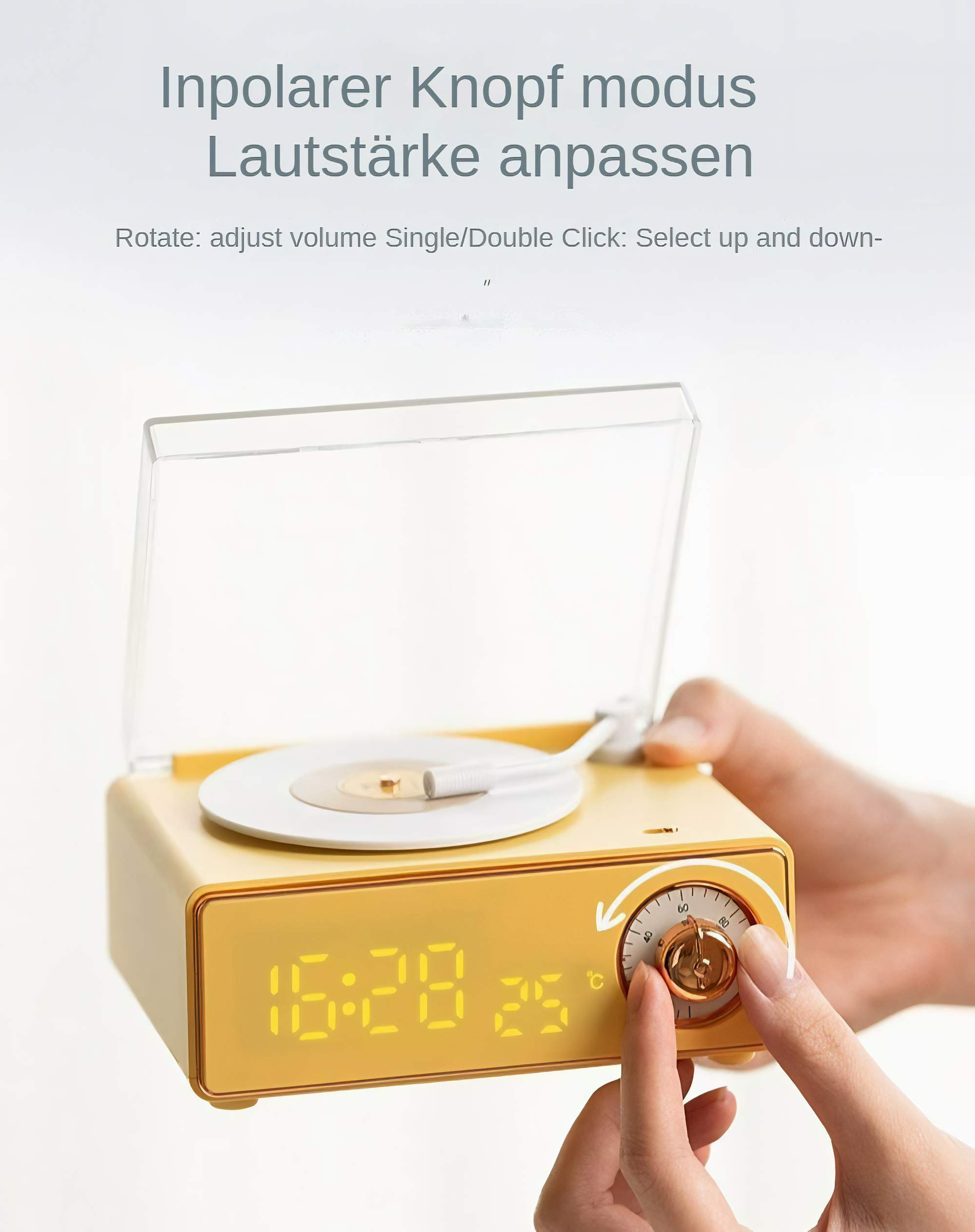 Eine gelbe Uhr im Vintage-Stil mit einem Zifferblatt. Eine Hand dreht das Zifferblatt. Die Zeit ist 16:28, die Temperatur 25°C.