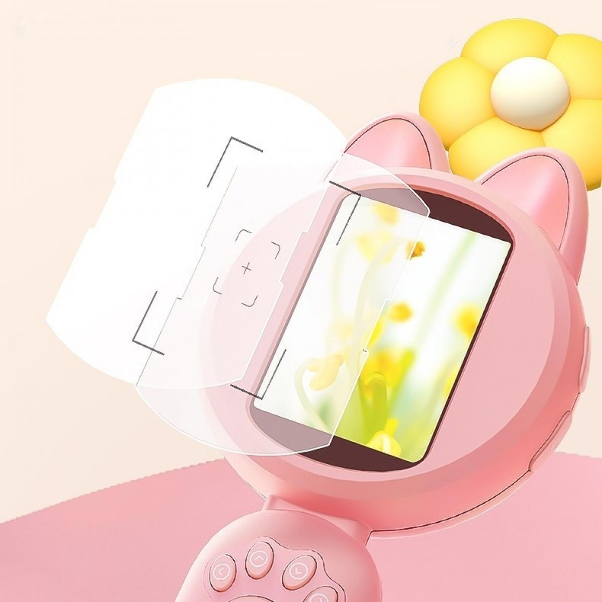 Ein rosa katzenförmiges Gerät mit Bildschirm und klarer Kunststoffabdeckung. Eine gelbe Blume im Hintergrund.