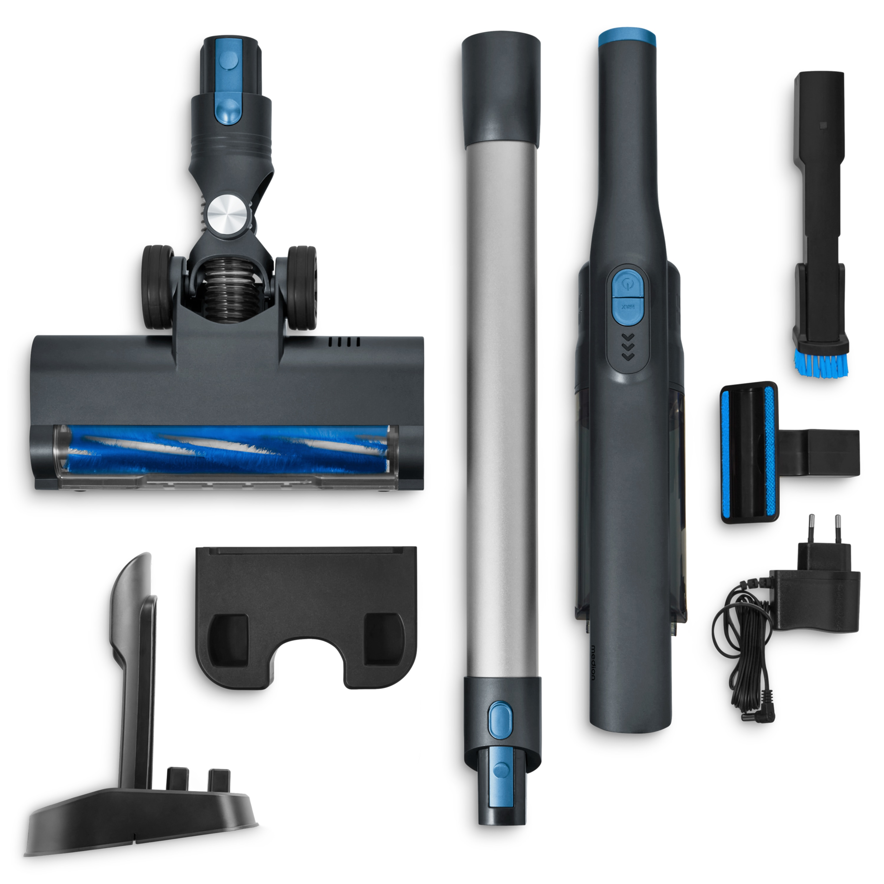 Vacuum cleaner parts are arranged on a white surface. Parts include the main body, a brush head, and various attachments.