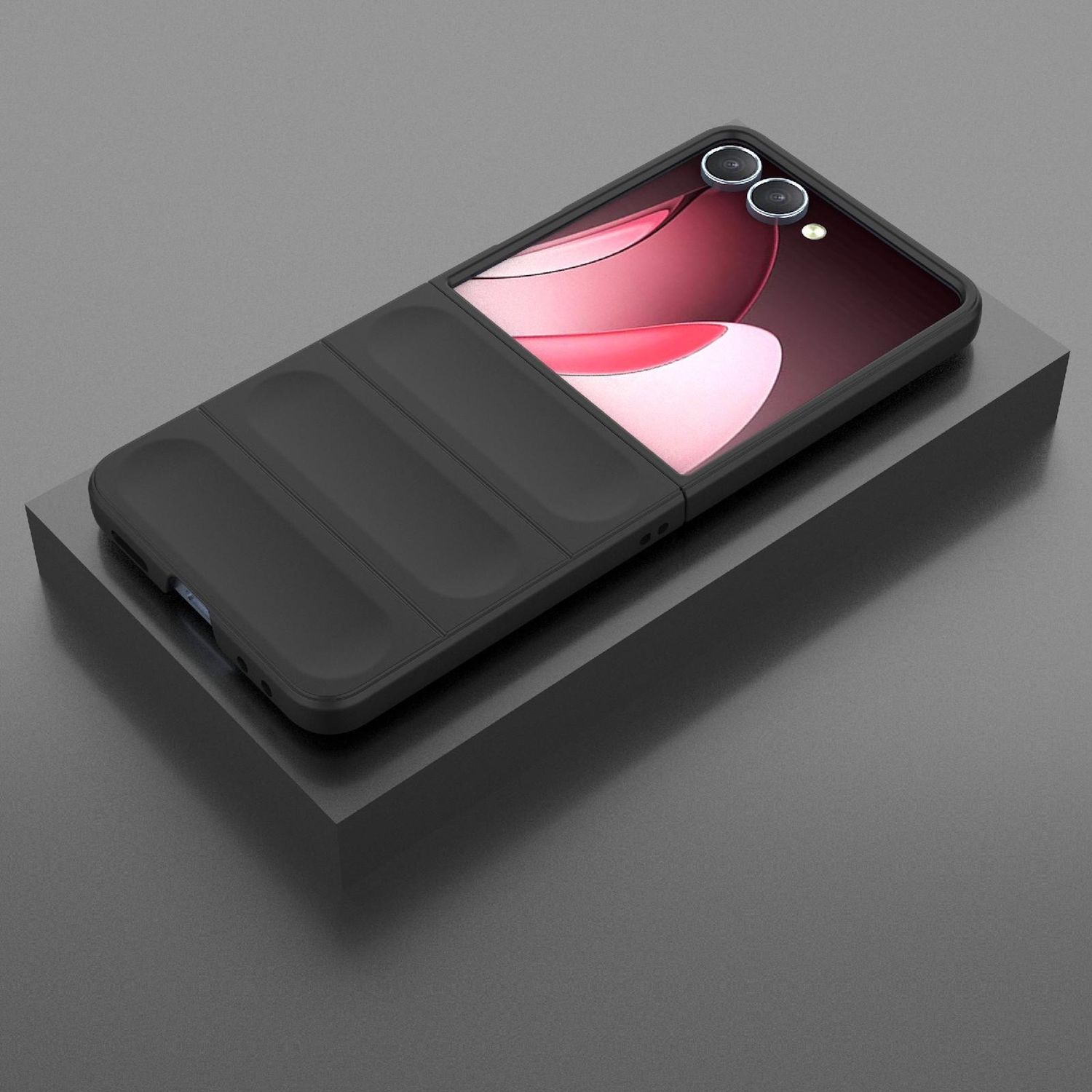 Eine schwarze Handyhülle liegt auf einem schwarzen Block. Der Bildschirm zeigt ein rosa-weißes Design. Der Hintergrund ist grau.