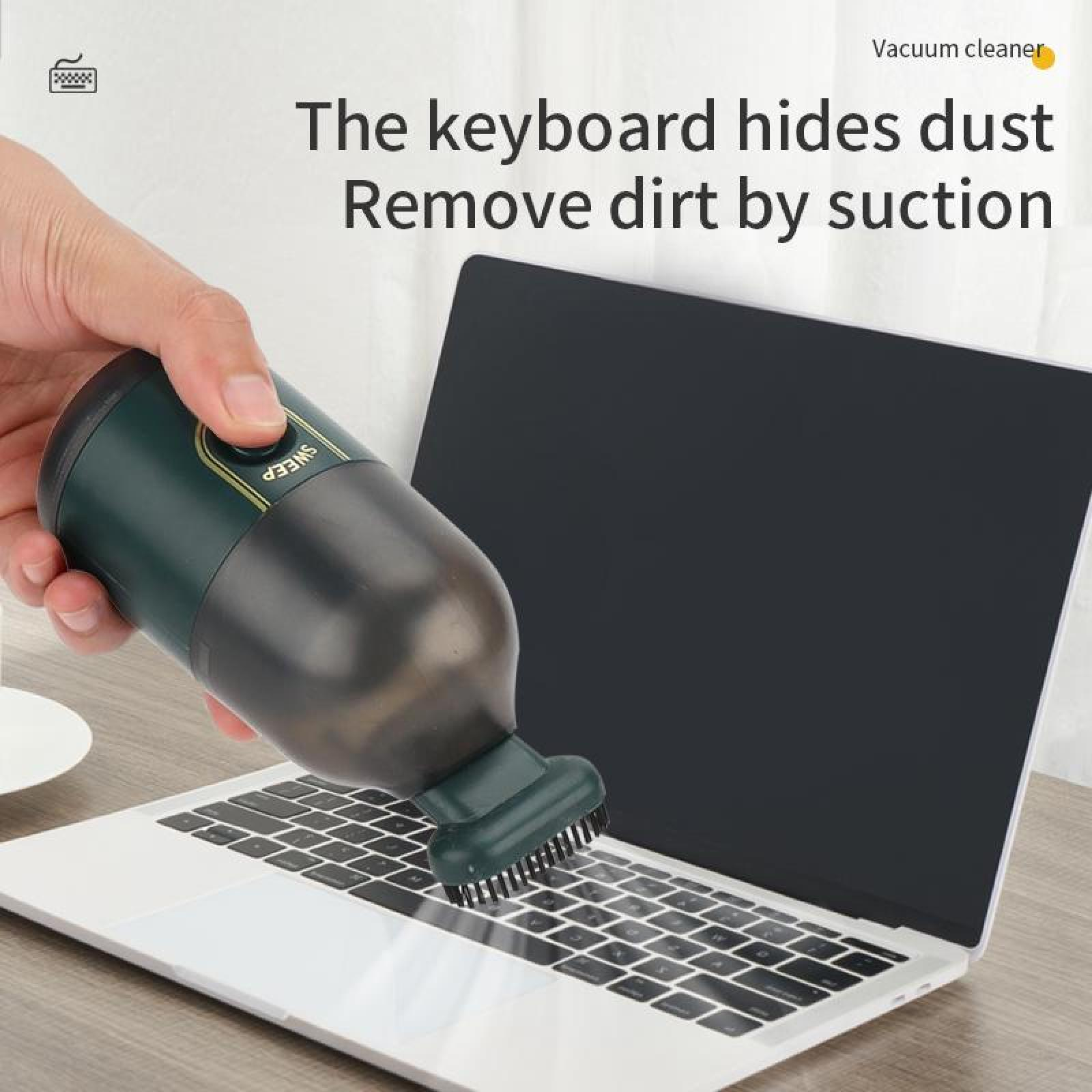 Eine Hand reinigt mit einem Mini-Staubsauger eine Laptop-Tastatur. Der Text lautet: 'Die Tastatur versteckt Staub. Entfernen Sie Schmutz durch Absaugen'.
