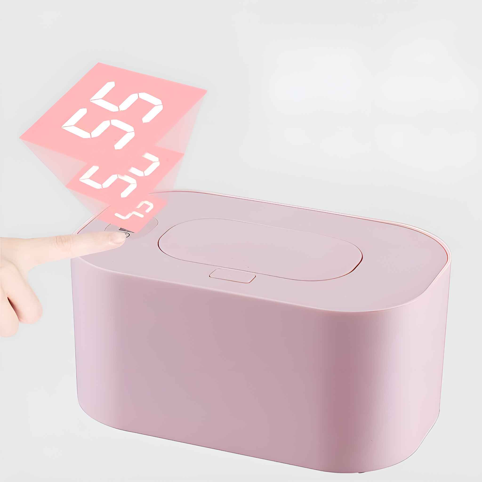 Ein rosa Wischtuchspender mit Digitalanzeige. Ein Finger berührt den Spender.