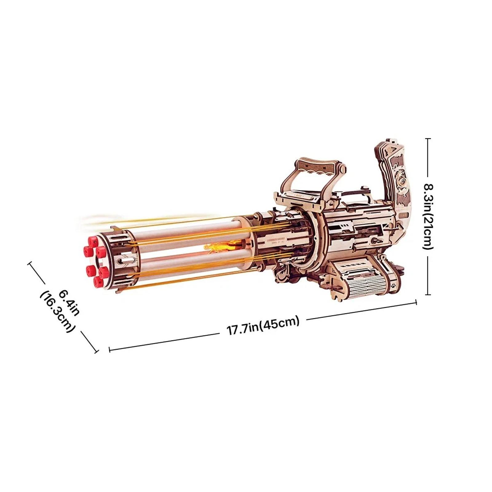 Ein hölzernes Gatling-Gewehr-Modell auf Weiß, mit beschrifteten Abmessungen. Die Waffe hat mehrere Läufe und einen Griff zum Zielen.