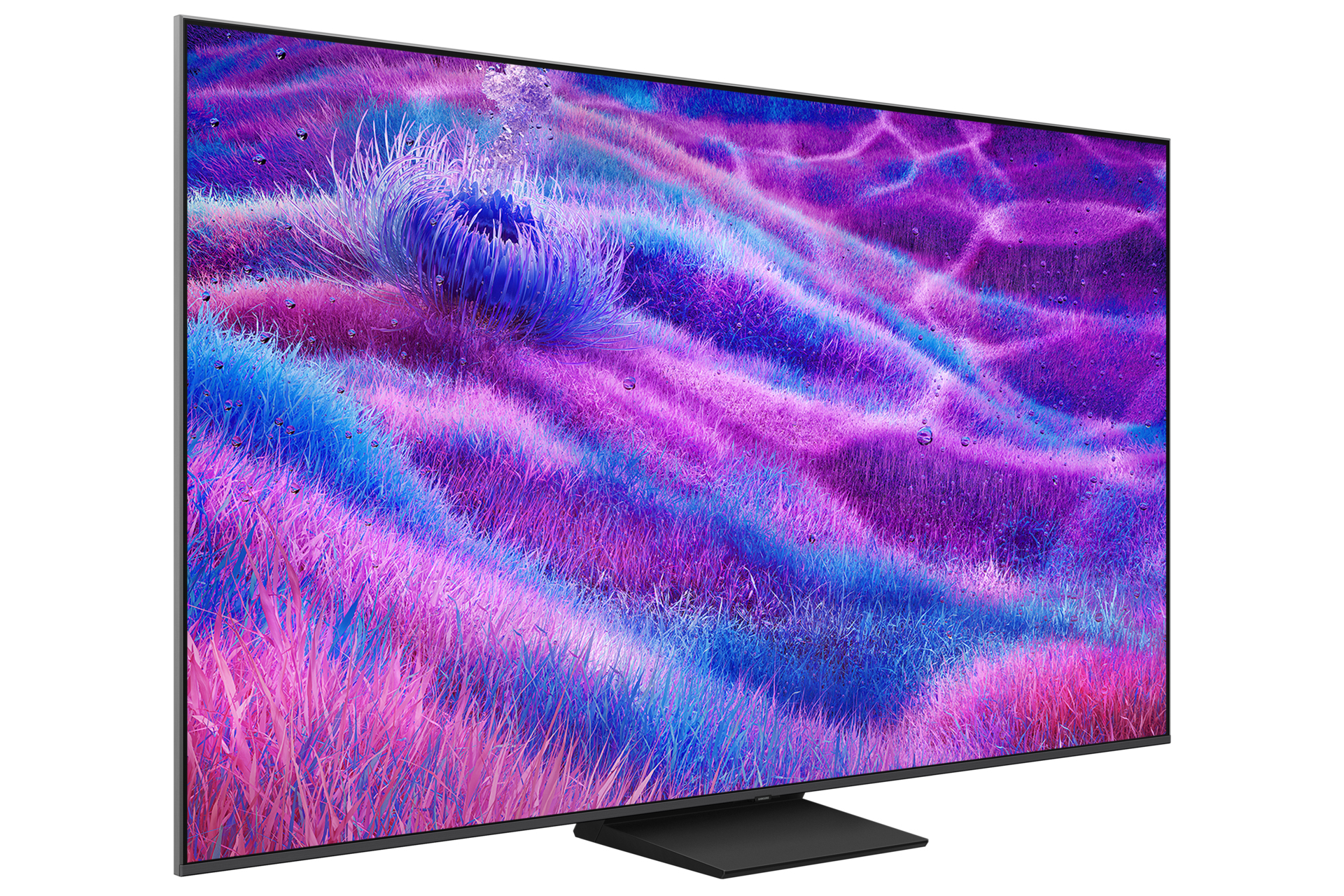 Un grande televisore mostra un'immagine astratta e colorata che ricorda un campo d'erba nei toni del viola, blu e rosa.