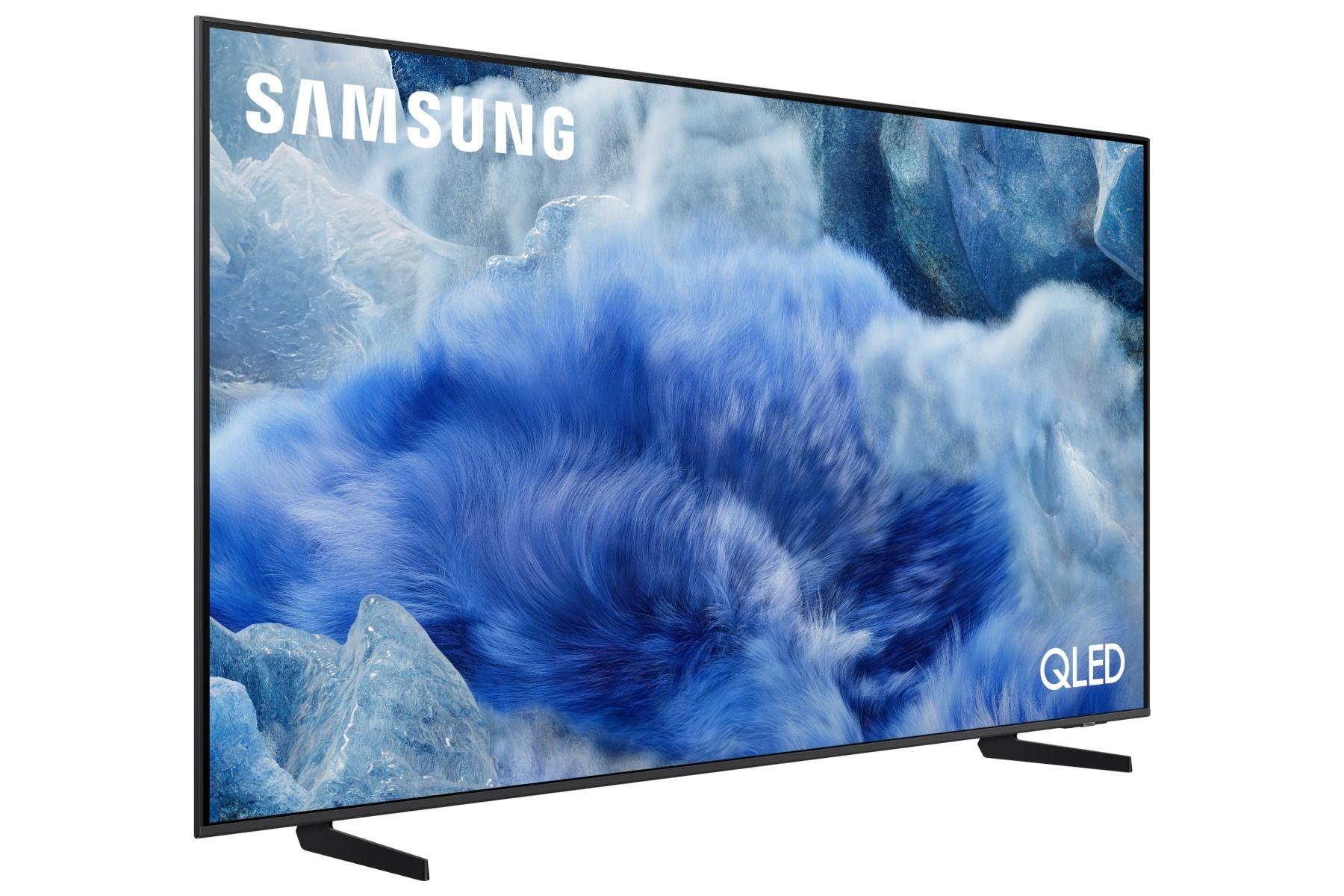 Un téléviseur Samsung QLED. L'écran affiche un paysage bleu et nuageux. Le téléviseur est noir, avec un pied. Le logo Samsung est visible.