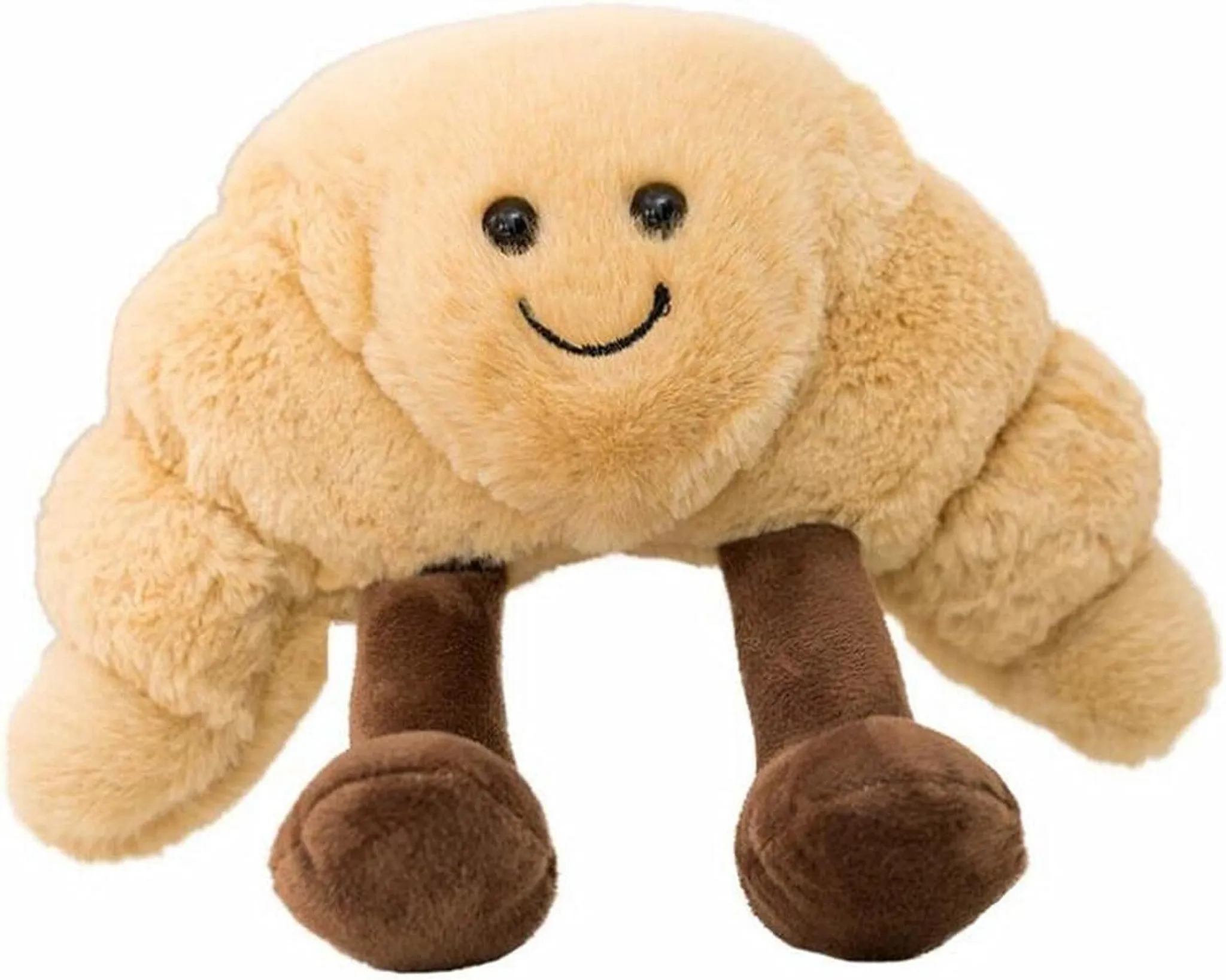 Ein Plüsch-Croissant-Spielzeug mit einem lächelnden Gesicht, schwarzen Augen und braunen Beinen. Das Spielzeug ist beige und hat eine flauschige Textur.