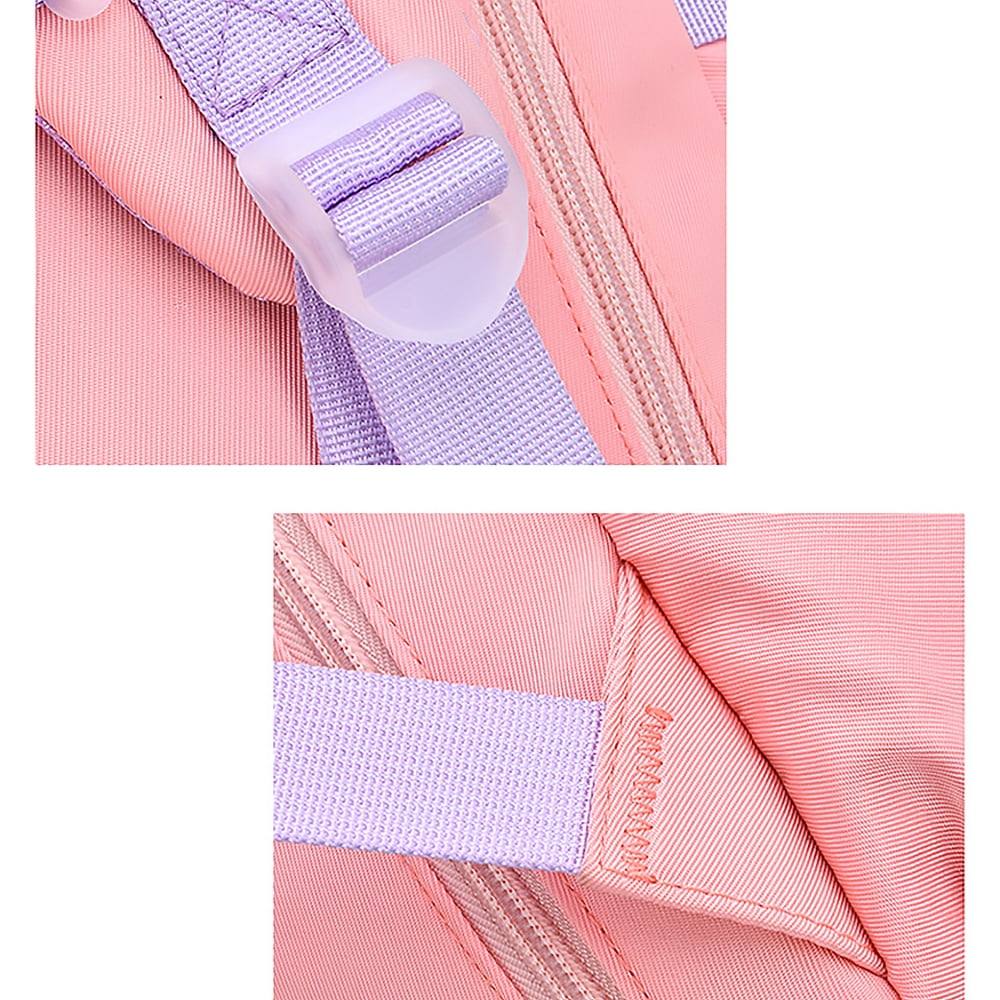 Nahaufnahme eines rosa Rucksacks mit lila Trägern und einer Kunststoffschnalle. Ein Reißverschluss ist mit dem Stoff sichtbar.