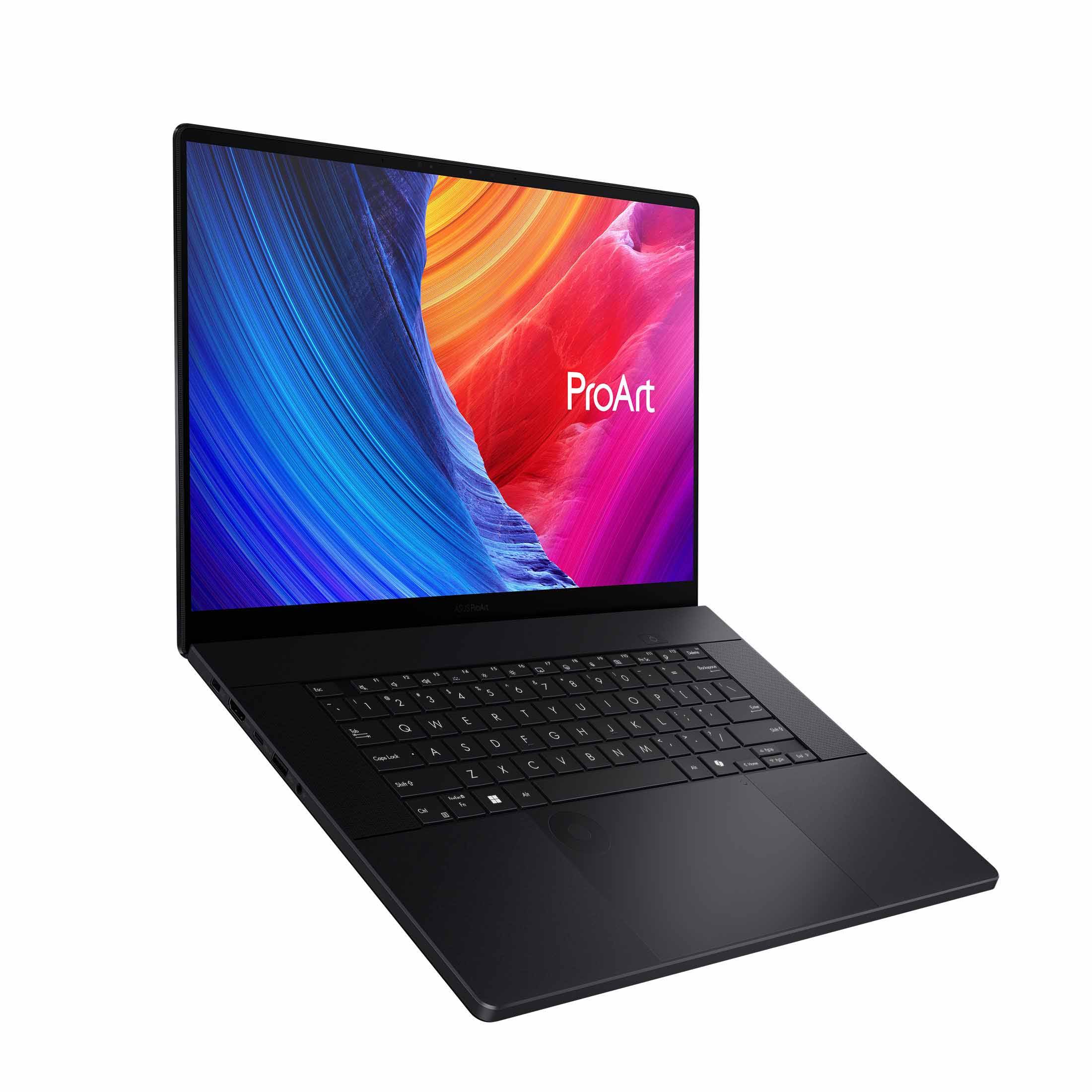 Schwarzer Laptop mit farbenfrohem Bildschirm. Anzeige zeigt 'ProArt'. Tastatur und Touchpad sind sichtbar. Schräge Ansicht vor weißem Hintergrund.