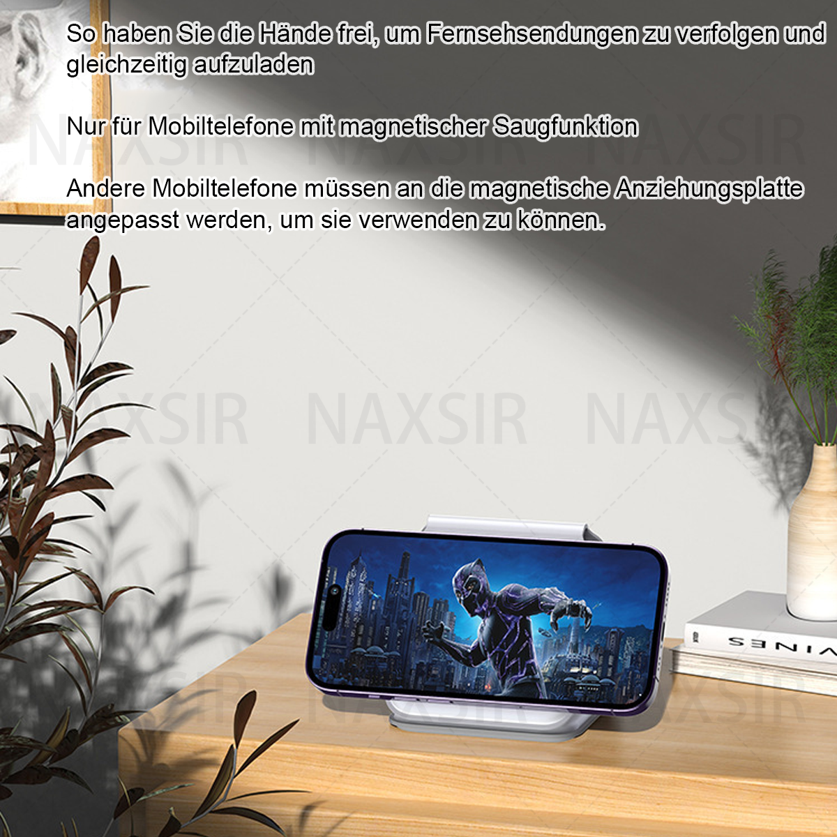 Ein Telefon auf einem Ladeständer zeigt ein Black Panther-Bild. Deutscher Text beschreibt Funktionen des Ständers und Telefonkompatibilität.