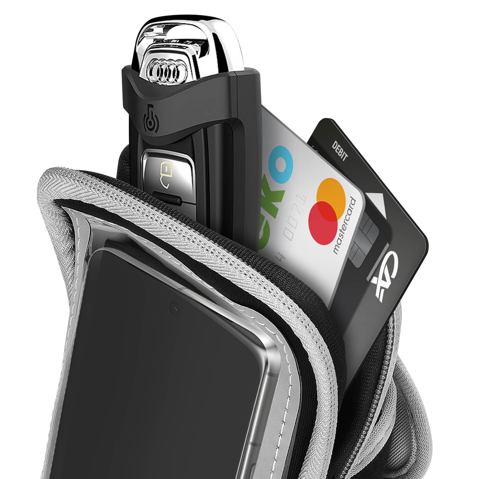 Ein schwarzes Telefon, Autoschlüssel und Karten in einer Telefonhalterung. Die Karten umfassen eine Mastercard und eine Debitkarte.