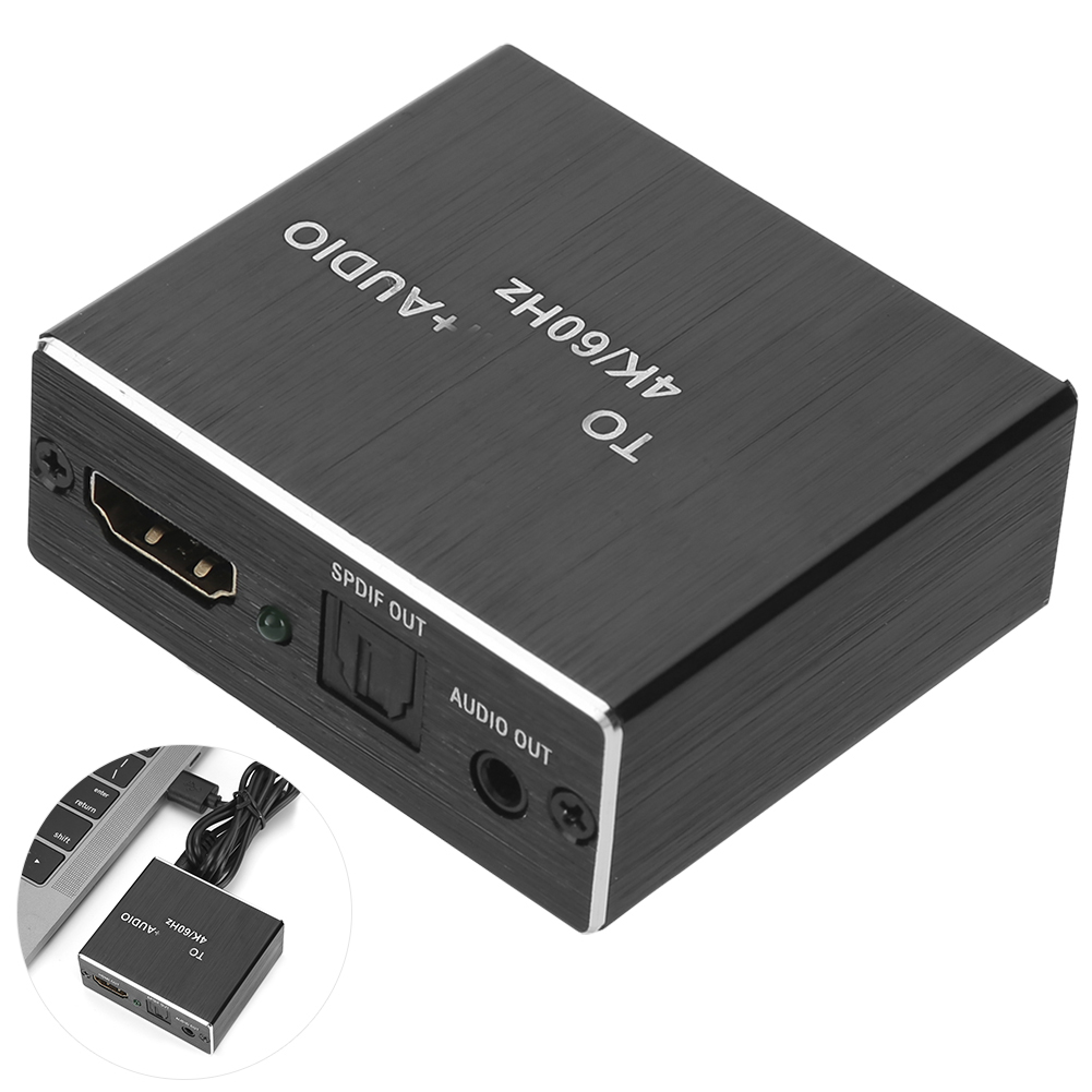 Ein schwarzer HDMI-Konverter mit den Aufschriften: TO 4K/60Hz, +AUDIO, SPDIF OUT, AUDIO OUT. Er liegt neben einem Laptop und Kabel.
