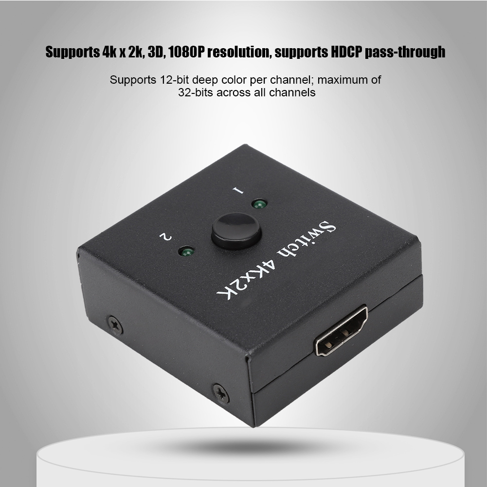Schwarzer 4K x 2K Switch auf weißer Plattform. HDMI-Anschluss, zwei Tasten und Beschriftungen. Text zur Videoauflösung steht oben.