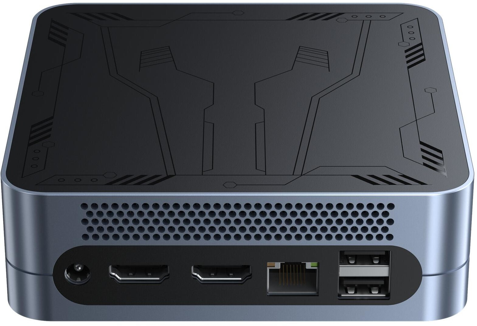 Mały, ciemnoszary komputer z wzorzystym blatem. Z przodu ma wiele portów i perforowany otwór wentylacyjny.