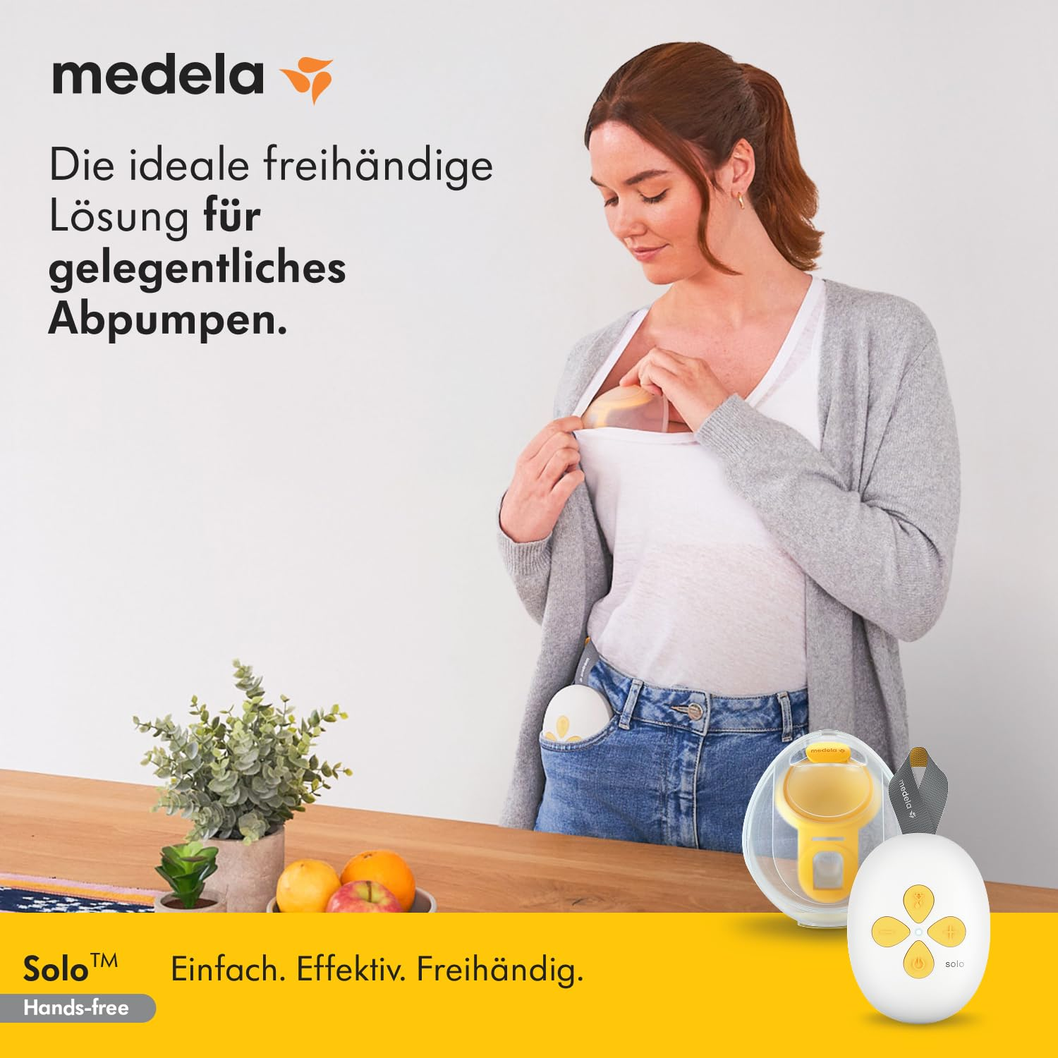 Eine Frau benutzt eine Brustpumpe. Gelbe Brustpumpe und Steuerung. Text lautet 'Die ideale freihändige Lösung für gelegentliches Abpumpen'.