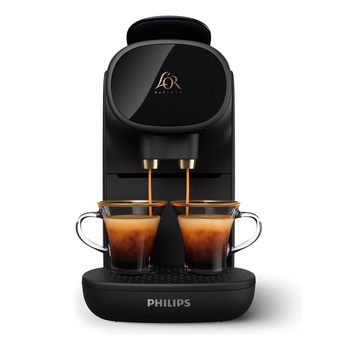 Cafetera L'OR Barista negra preparando espresso en dos tazas de cristal. Detalles dorados. Logotipo de Philips.