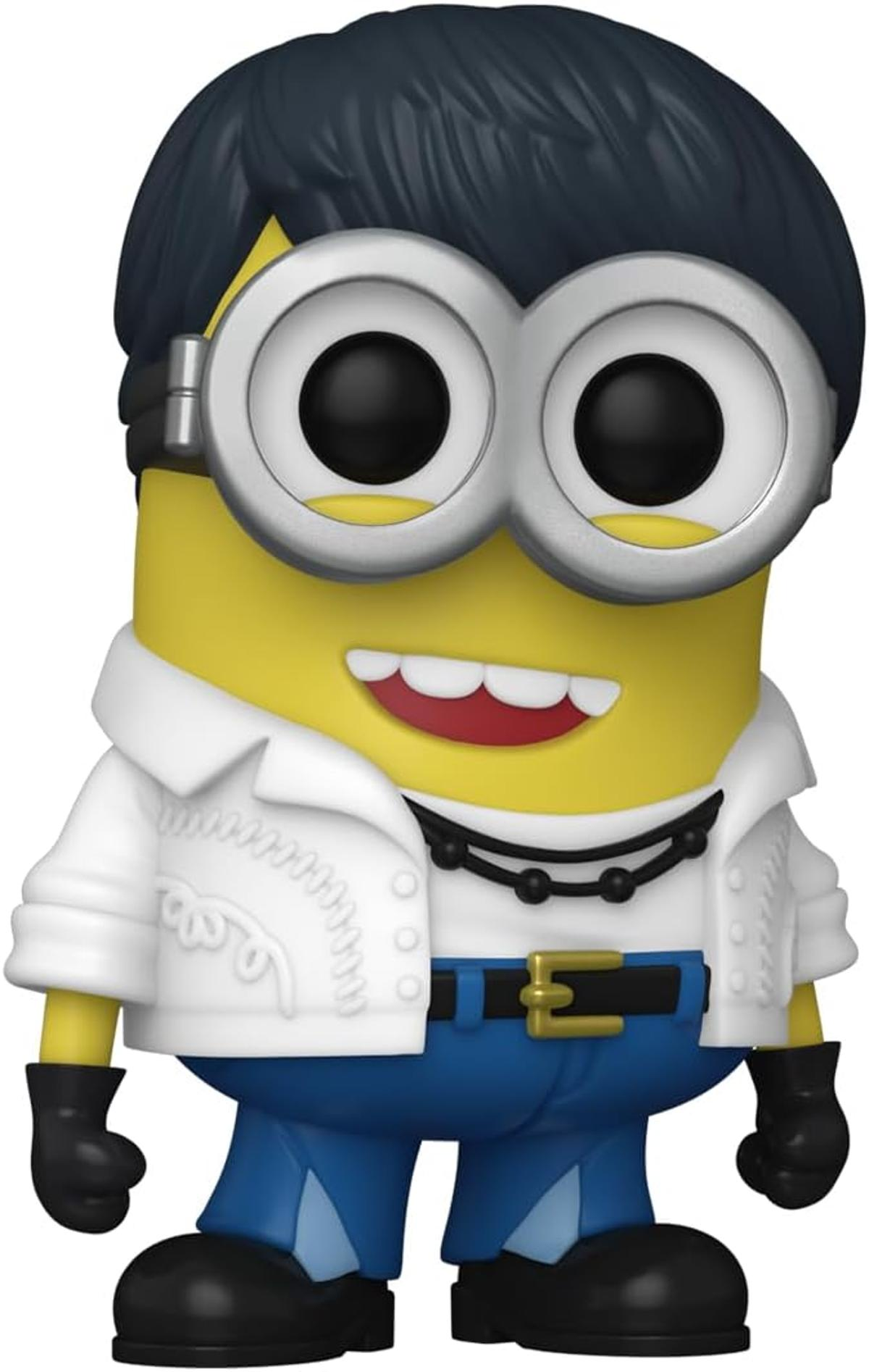 Una figura amarilla de Minion vestida como Elvis Presley, con pelo oscuro, chaqueta blanca, pantalones azules y zapatos negros, sonriendo.