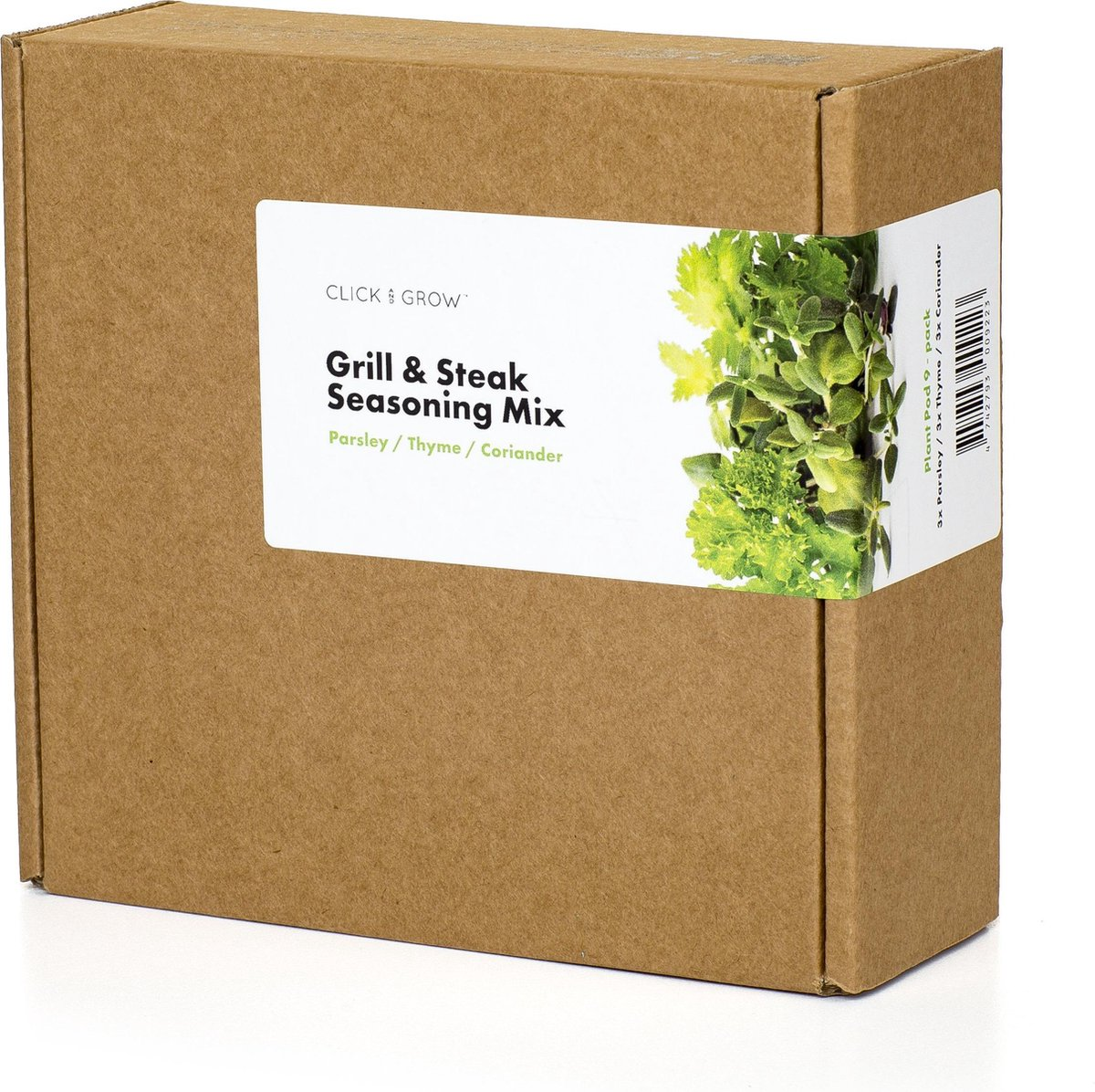 Une boîte en carton avec une étiquette indiquant 'Grill & Steak Seasoning Mix'. Des herbes fraîches sont visibles, avec les mots 'Persil/Thym/Coriandre'.