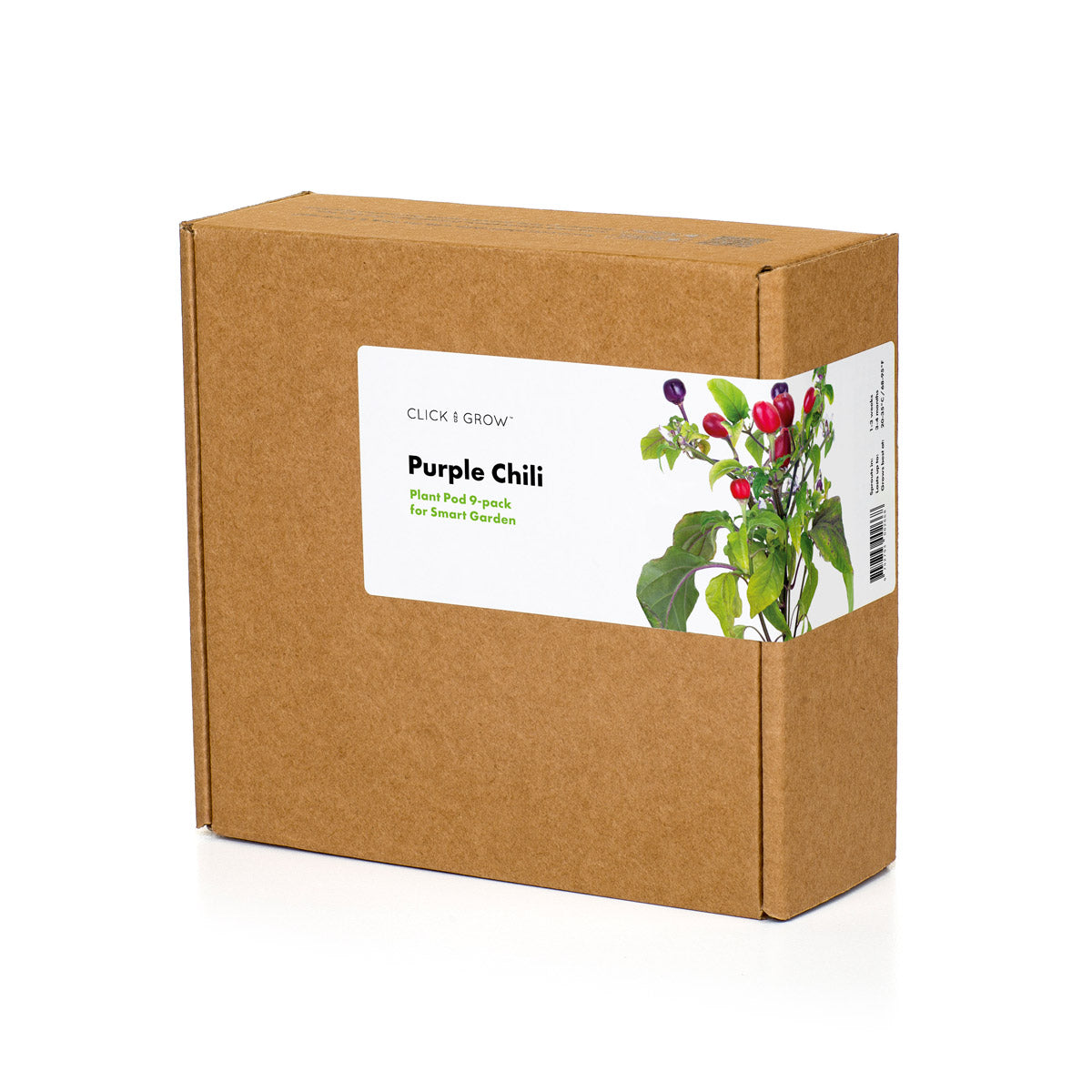 Une boîte en carton marron avec une étiquette indiquant 'Purple Chili'. Elle montre un plant de piment avec des poivrons violets et rouges.