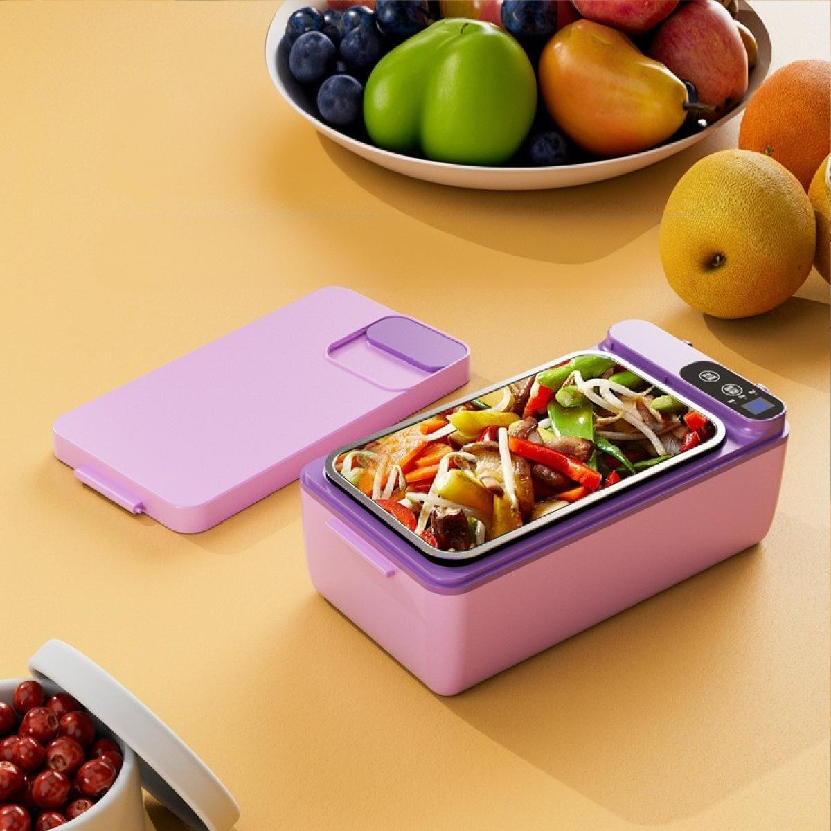 Eine Lunchbox mit Essen und eine Schüssel mit Früchten stehen auf einer gelben Oberfläche. Die Lunchbox ist offen und zeigt Gemüse.