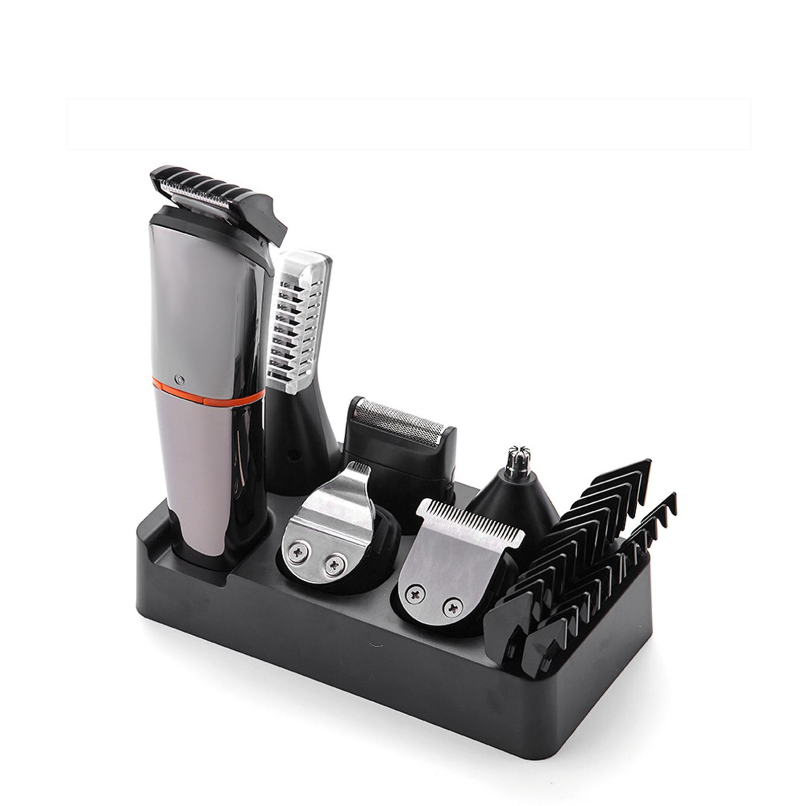 Ein schwarzes Pflege-Set mit mehreren Aufsätzen. Es hat einen Rasierer, Trimmerköpfe und eine Basis.