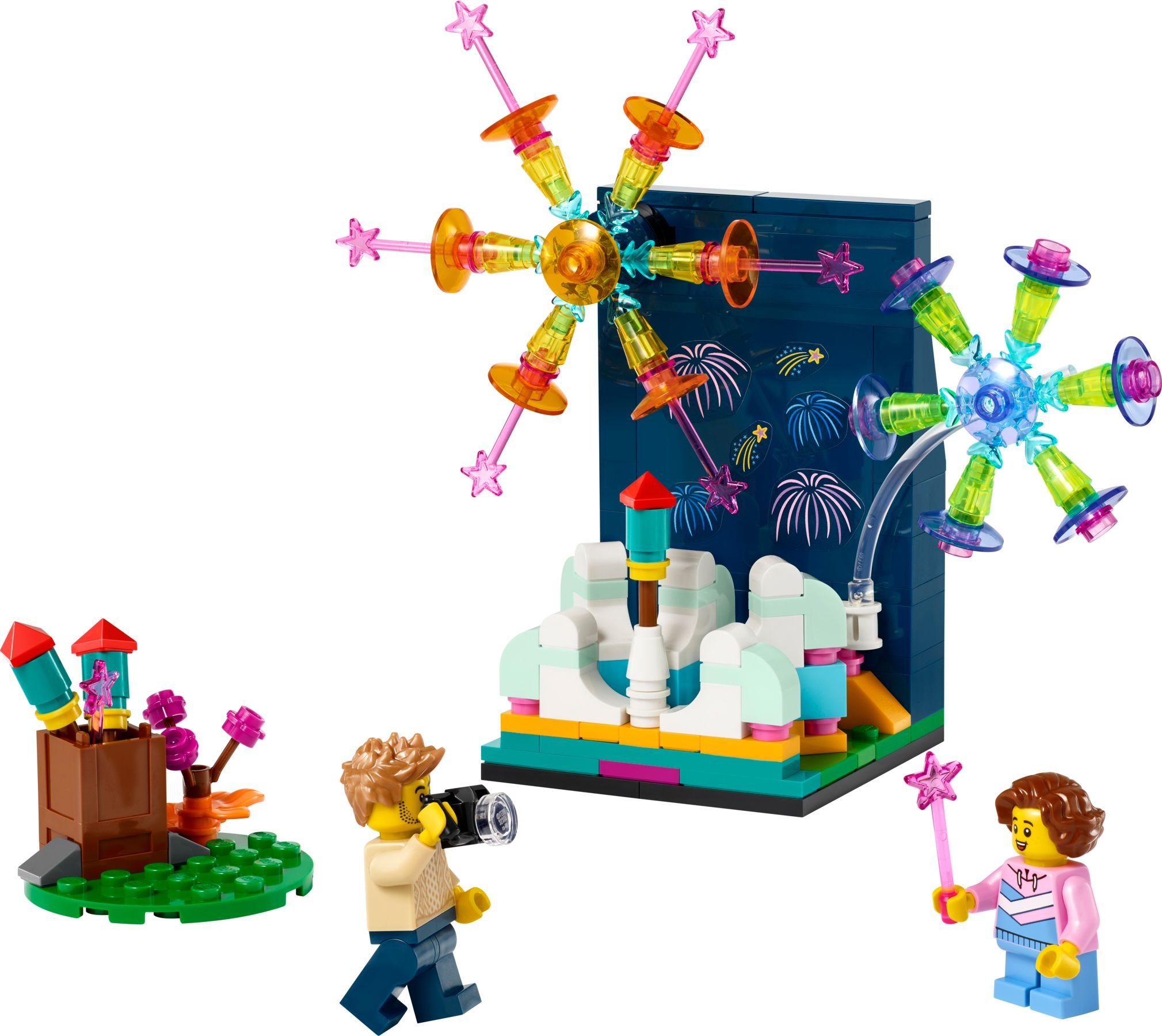 Lego-Set mit Feuerwerk, Minifiguren und verschiedenen Strukturen. Enthält einen Fotografen und eine Person mit Zauberstab.