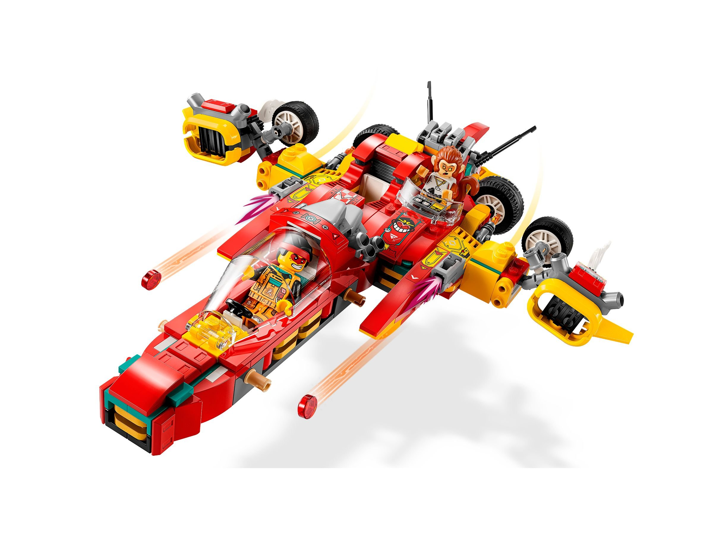 Ein rotes und gelbes Lego-Raumschiff mit Minifiguren. Es hat zwei Cockpits und Räder. Zwei orangefarbene Spuren gehen davon aus.