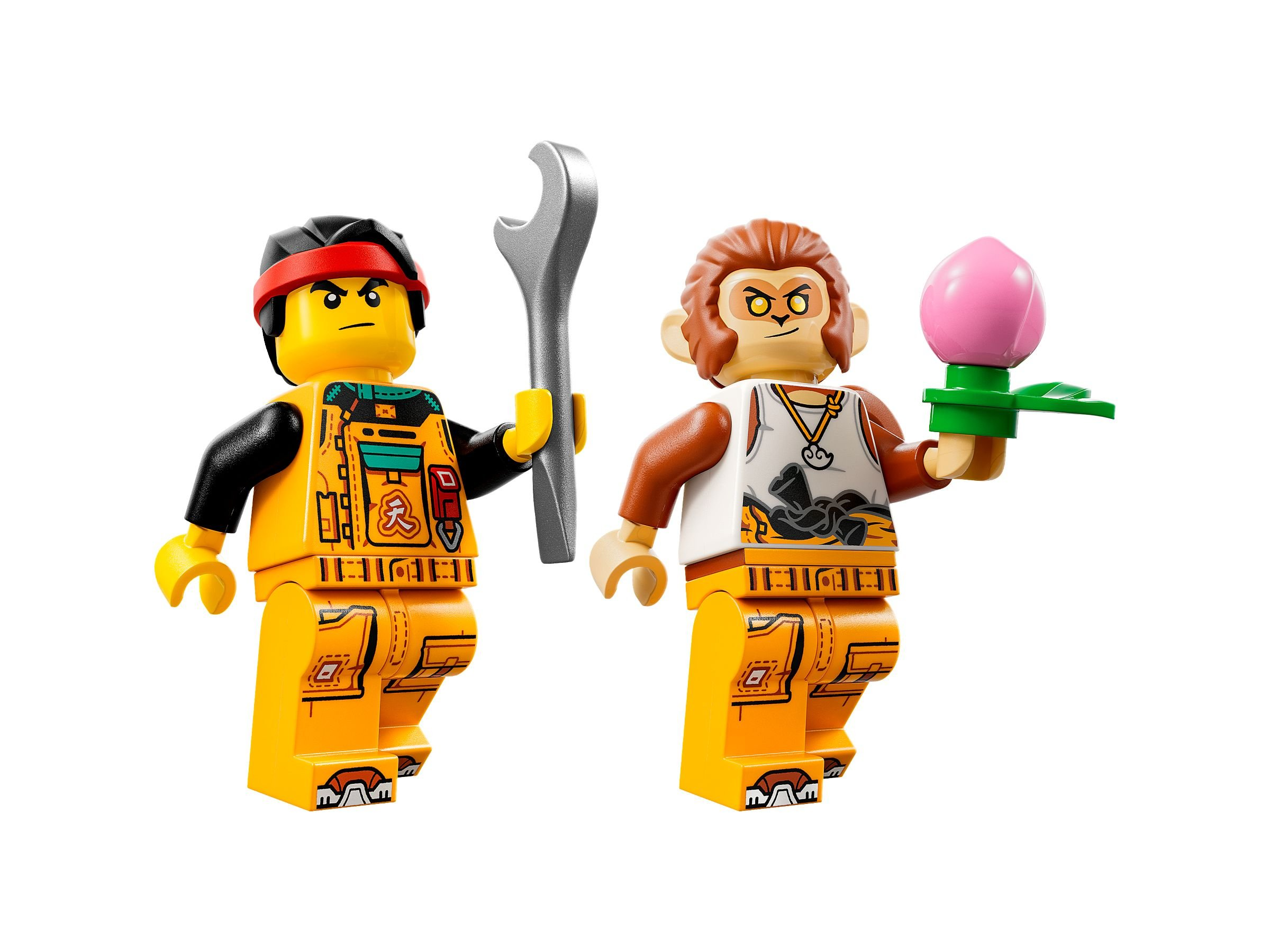Zwei Lego-Figuren. Eine hält einen Schraubenschlüssel, die andere einen Pfirsich. Beide sind gelb. Einer ist ein Affe.