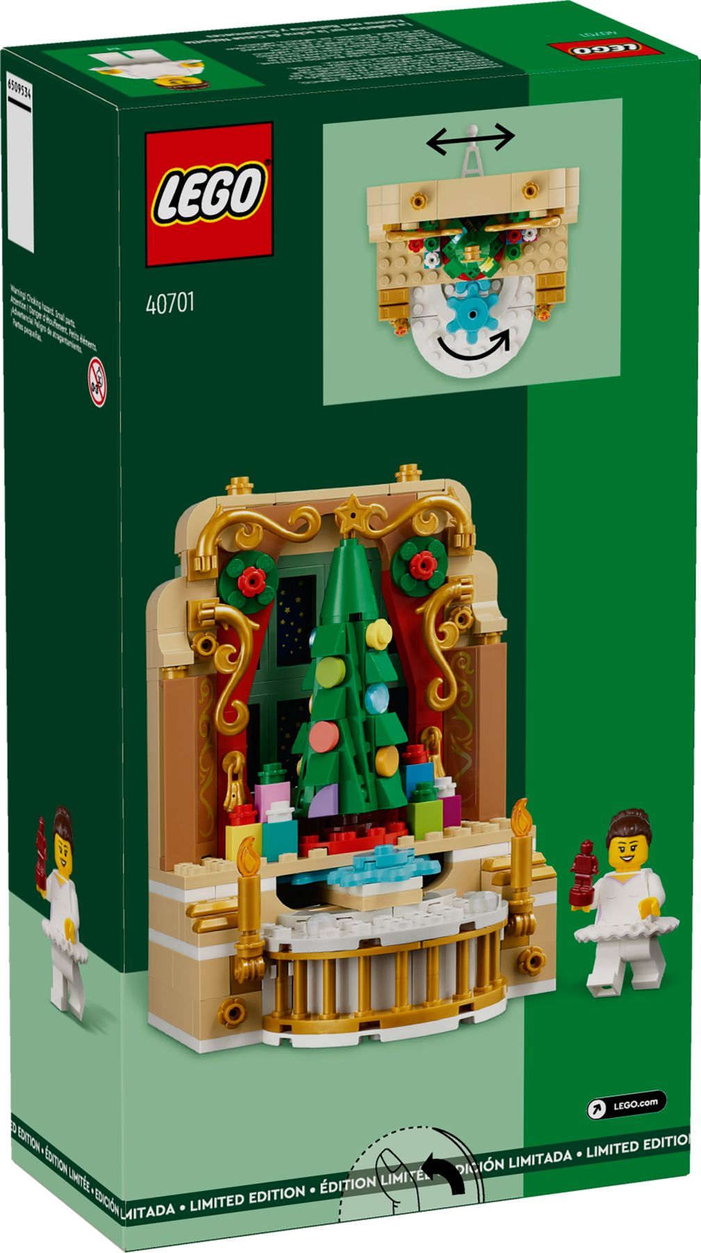 Lego-Box. Eine Weihnachtsszene mit Baum, Geschenken und Figuren. Grüner Hintergrund.
