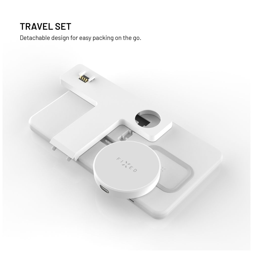 Weißes Reiseset mit abnehmbarem Design. Ein rundes 'FIXED'-Gerät liegt auf einer größeren, T-förmigen Basis. Text lautet 'TRAVEL SET'.