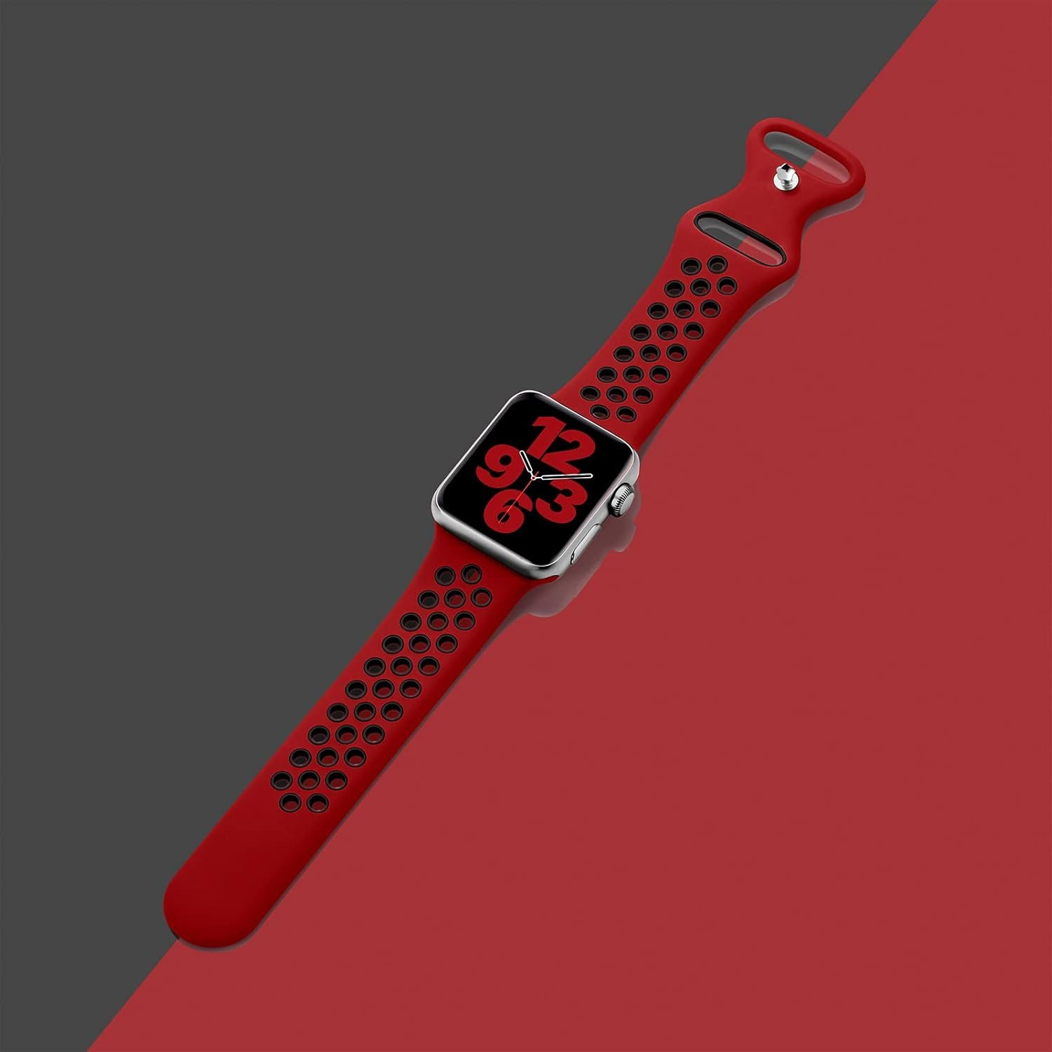 Eine rote Apple Watch mit rotem Armband und schwarz-rotem Hintergrund. Die Uhr zeigt die Zeit 12:03 an.
